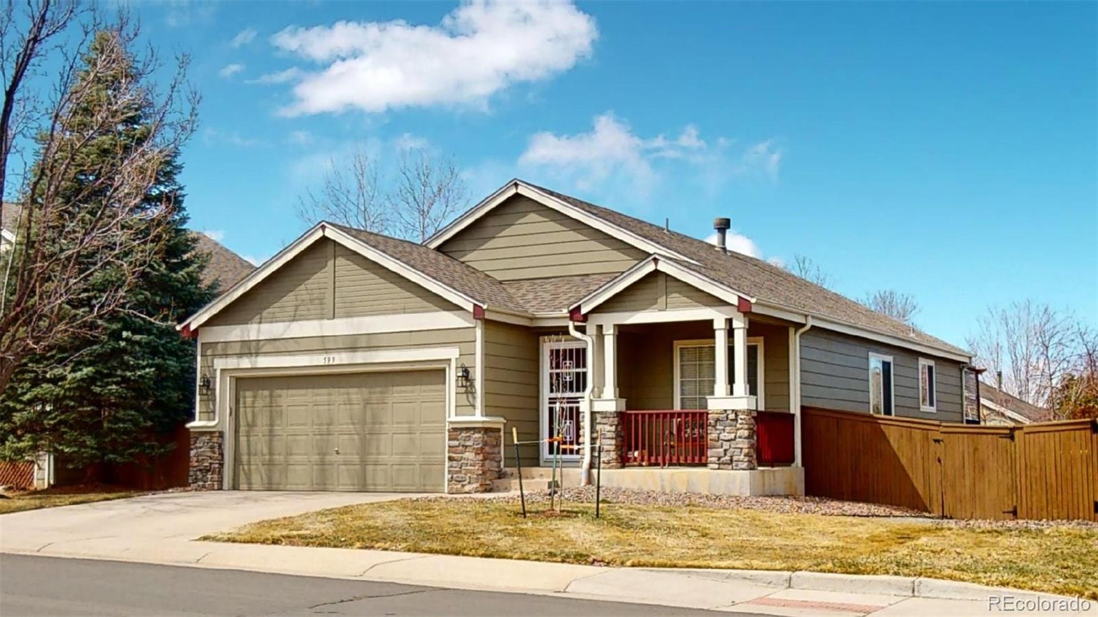 599 Timbervale Trail Highlands Ranch, CO 80129 - Photo 1 of 32 a front view of a house with a yard