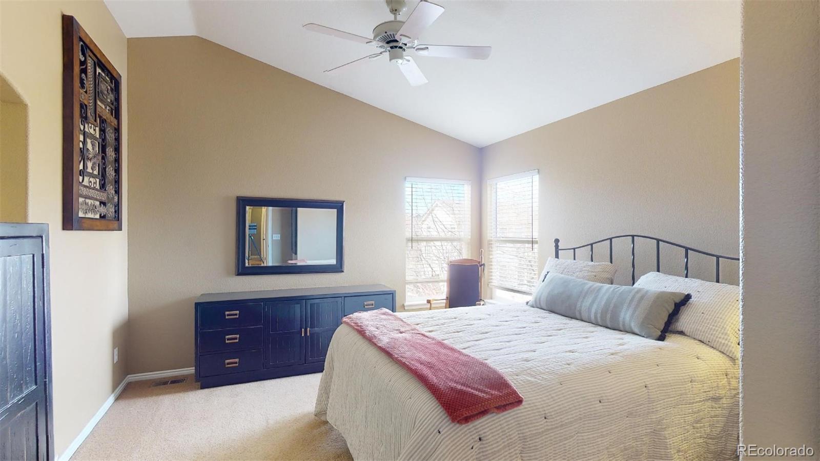 599 Timbervale Trail Highlands Ranch, CO 80129 - Photo 15 of 32 a bedroom with a bed and window