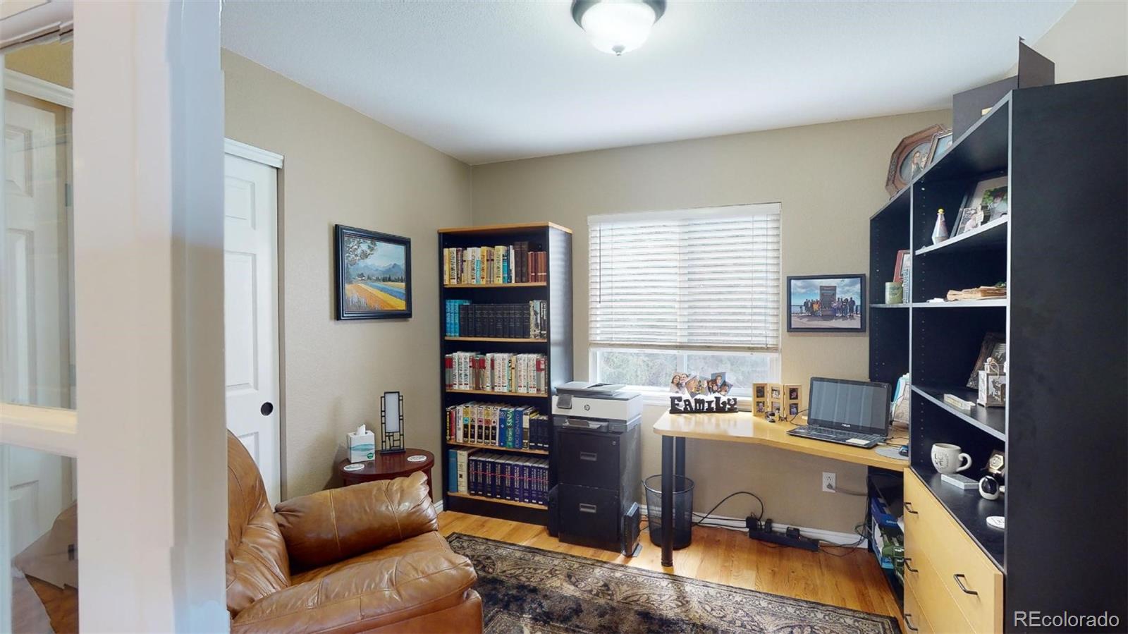 599 Timbervale Trail Highlands Ranch, CO 80129 - Photo 19 of 32 a view of a livingroom with workspace and a window