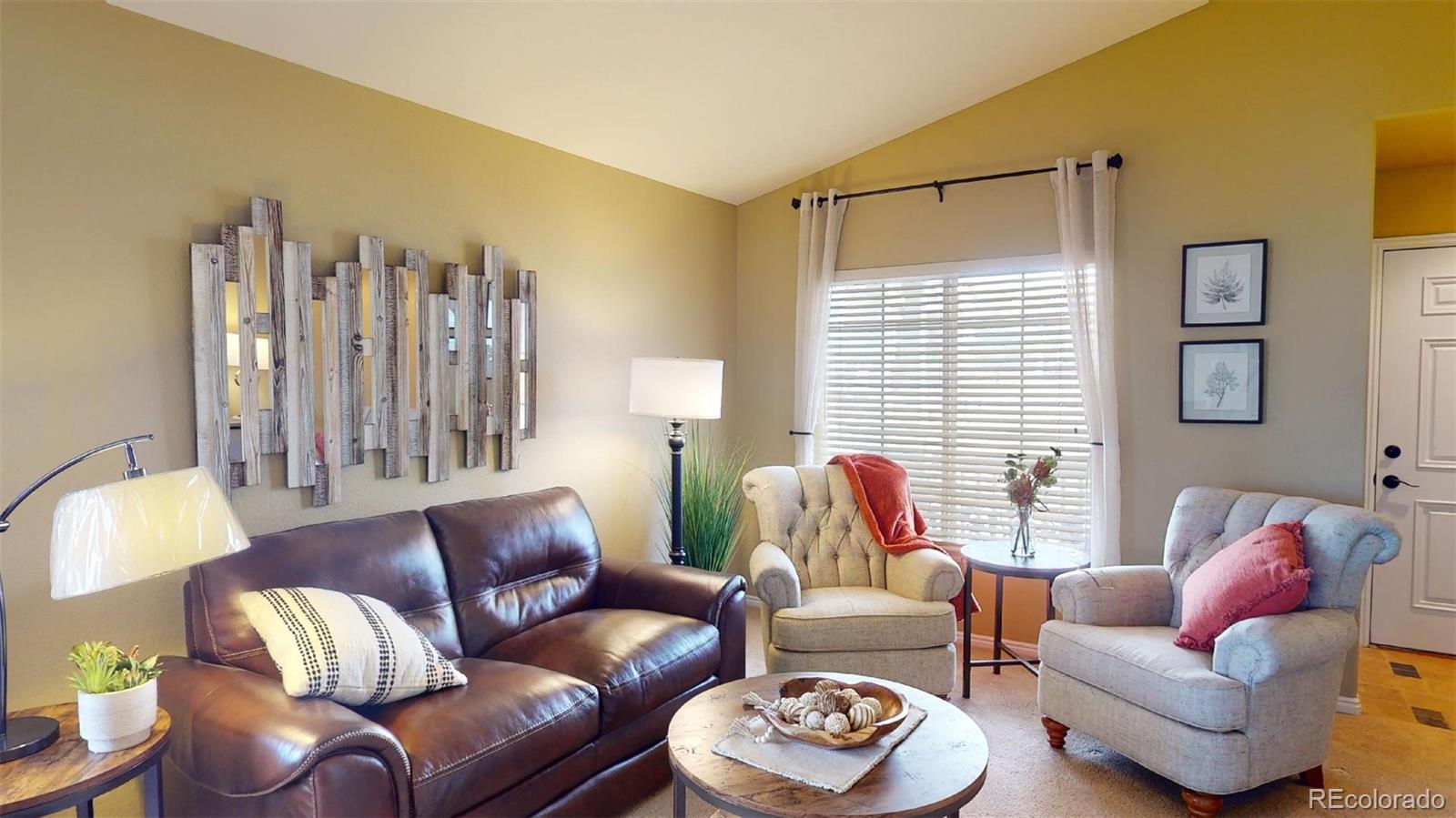 599 Timbervale Trail Highlands Ranch, CO 80129 - Photo 5 of 32 a living room with furniture and a large window