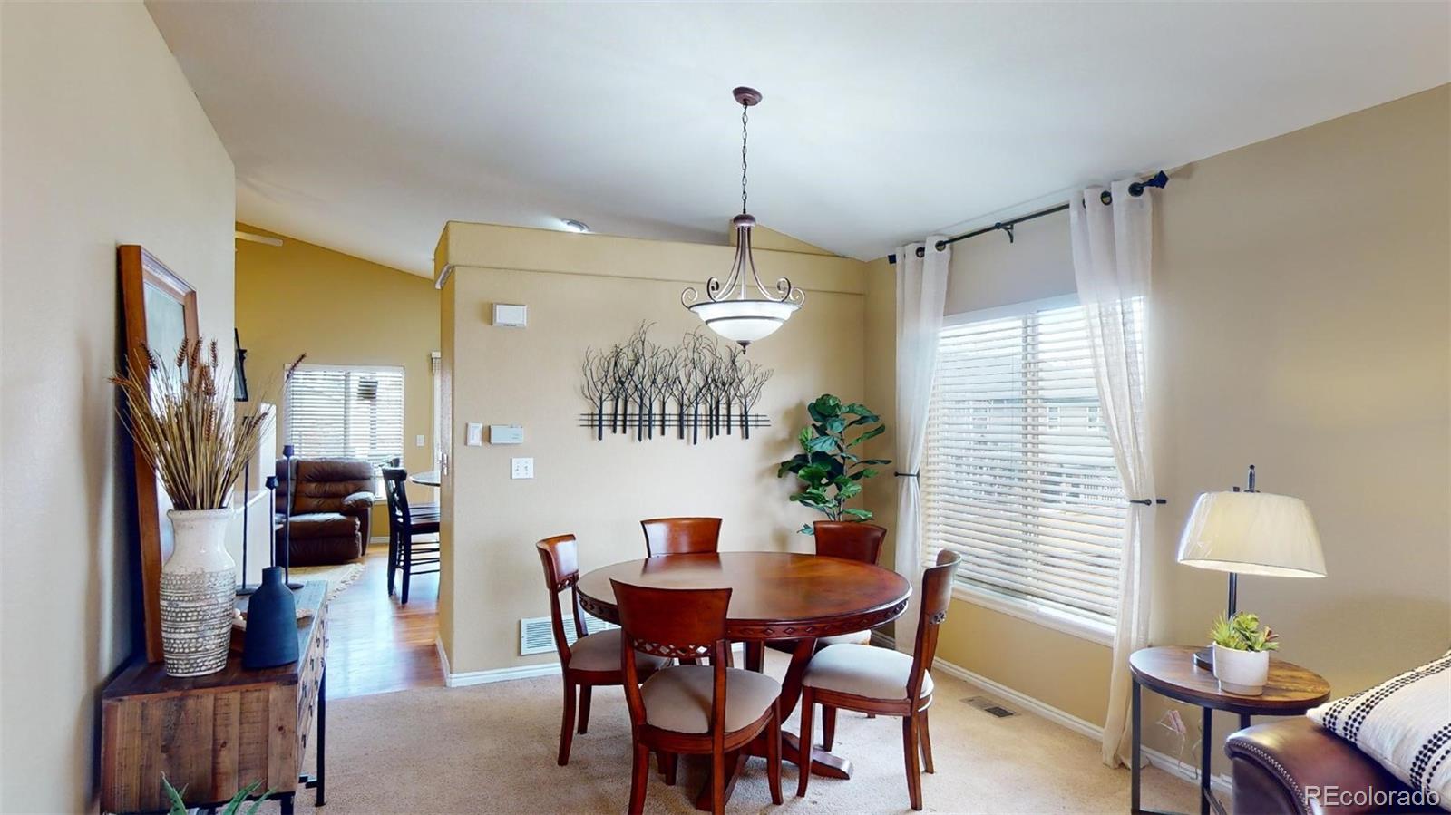 599 Timbervale Trail Highlands Ranch, CO 80129 - Photo 6 of 32 a dining room with furniture and window