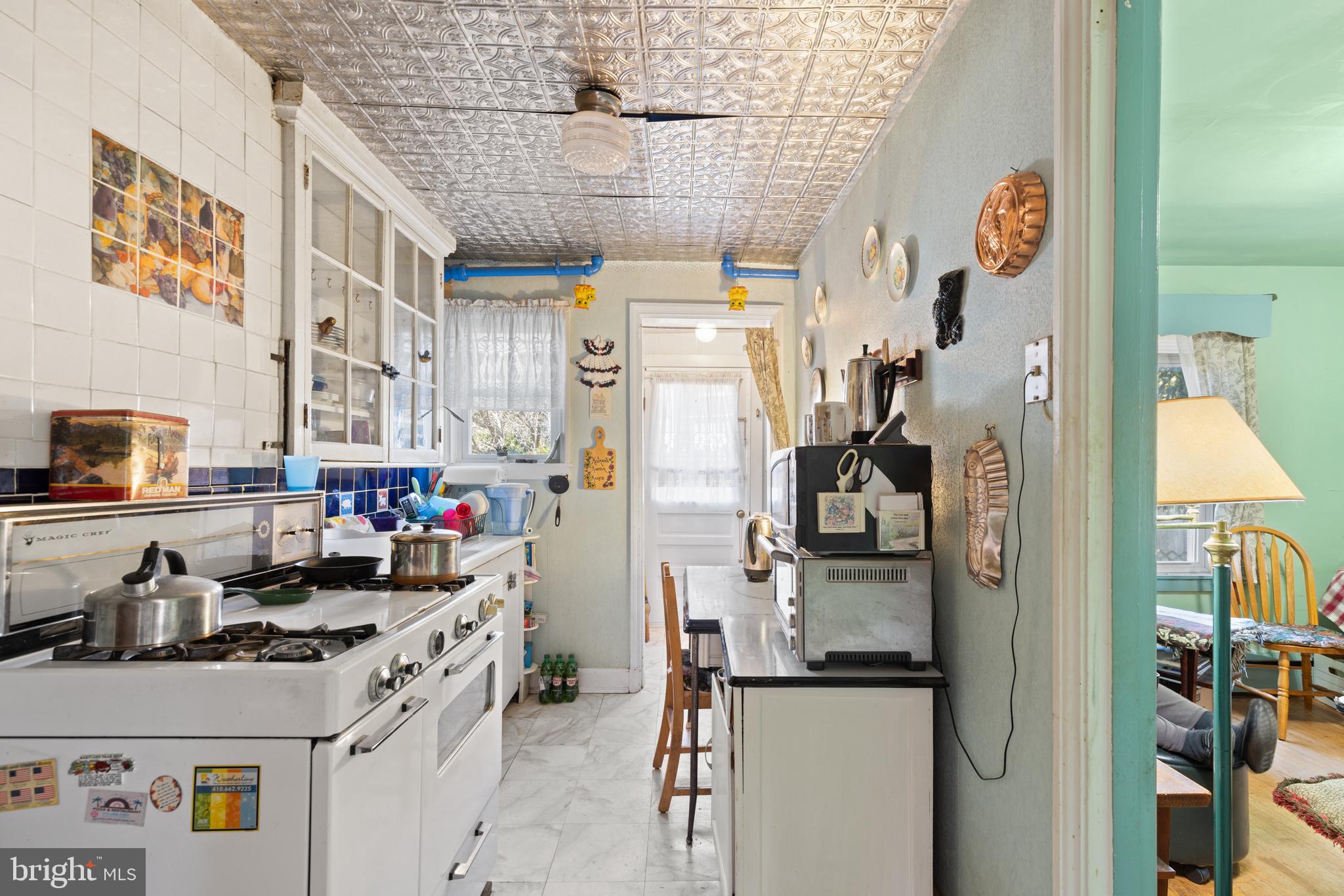 12 Flagship Road Dundalk, MD 21222 - Photo 8 of 19 a kitchen with stainless steel appliances a sink and a refrigerator