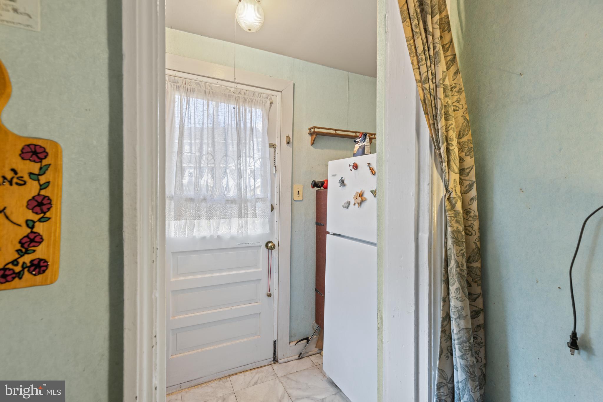 12 Flagship Road Dundalk, MD 21222 - Photo 9 of 19 a bathroom with a shower curtain and a window
