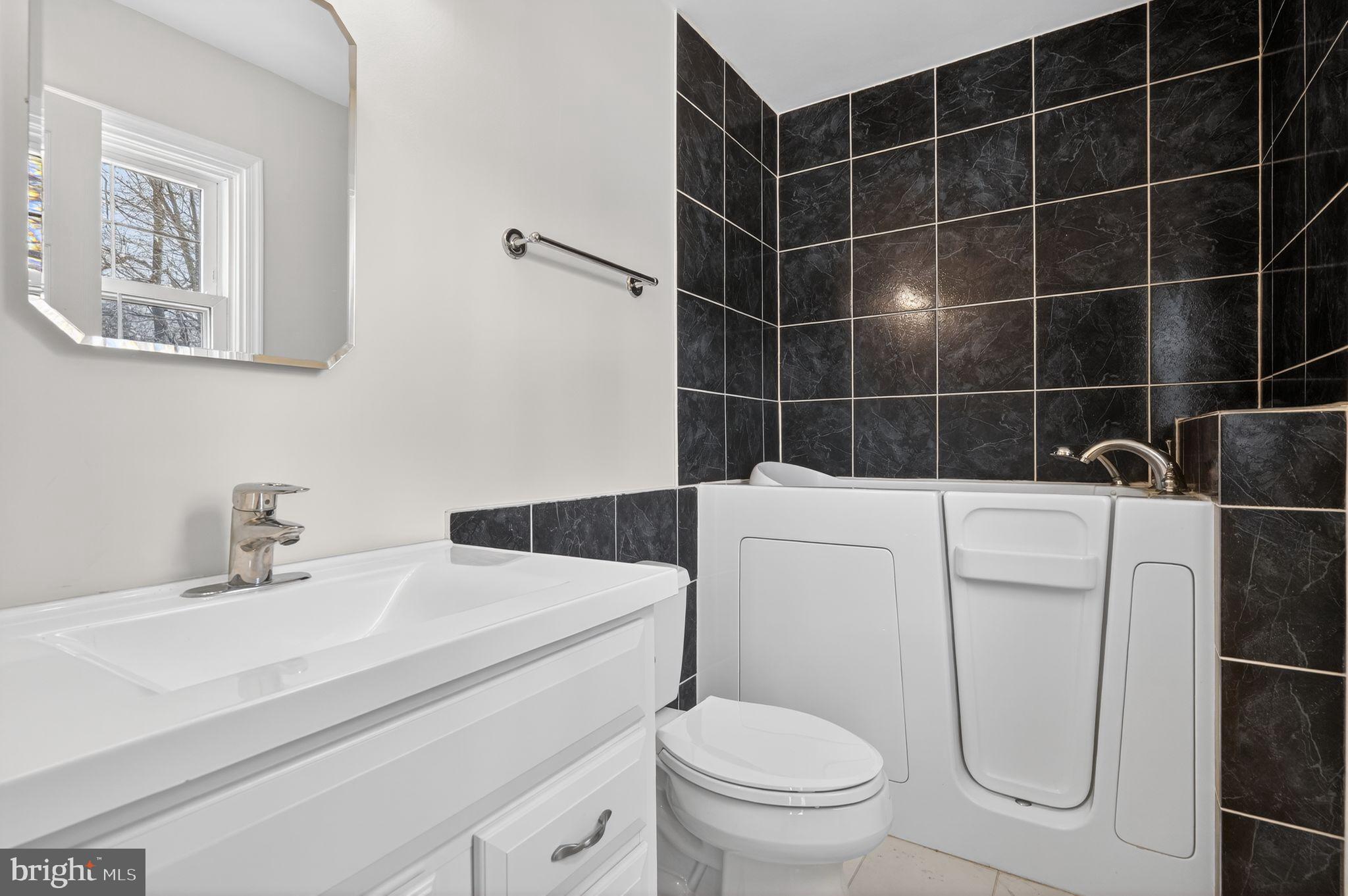 1629 Eton Way Crofton, MD 21114 - Photo 21 of 46 a bathroom with a sink toilet and shower