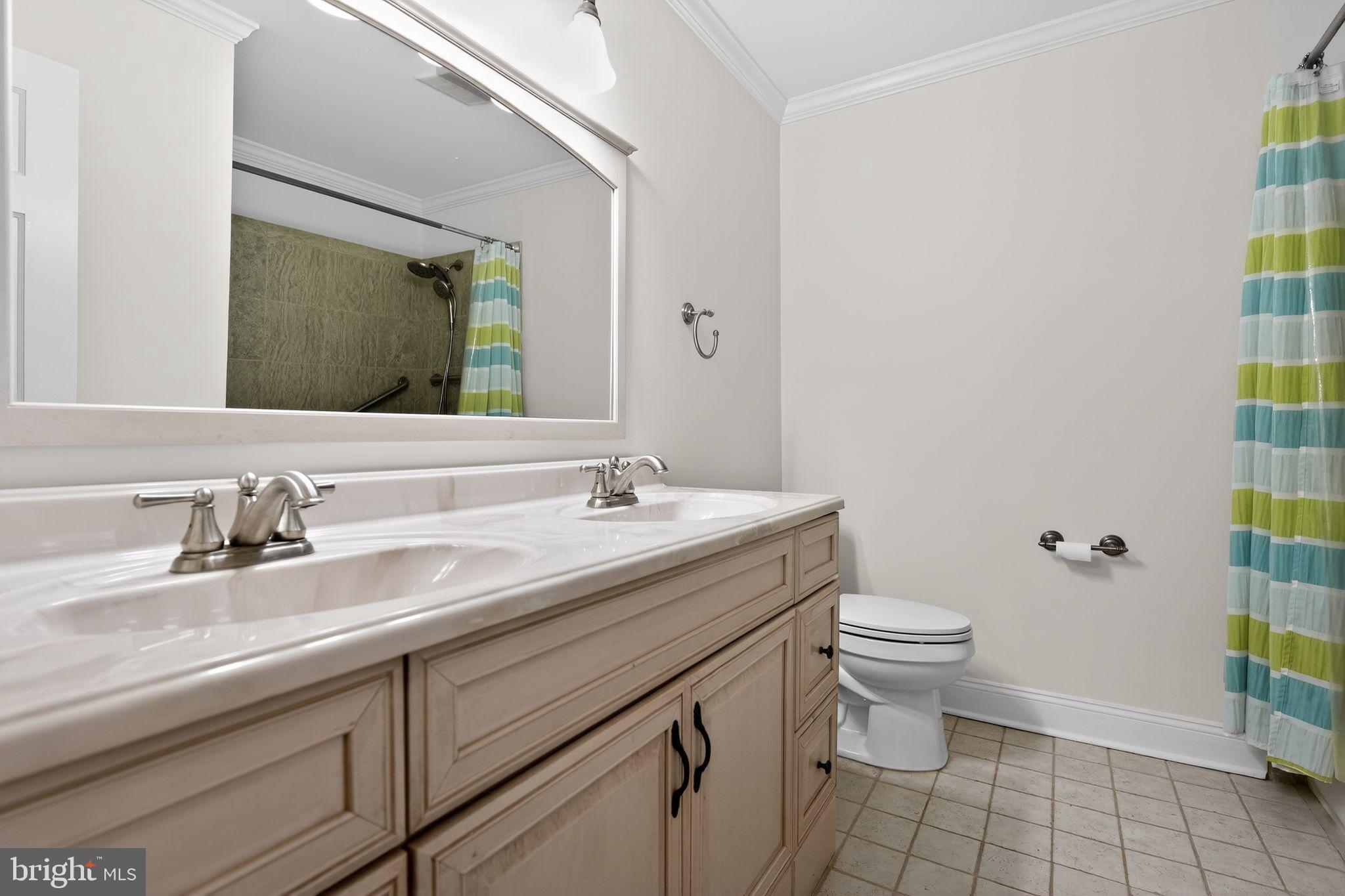 1629 Eton Way Crofton, MD 21114 - Photo 26 of 46 a bathroom with a granite countertop sink a toilet and a mirror