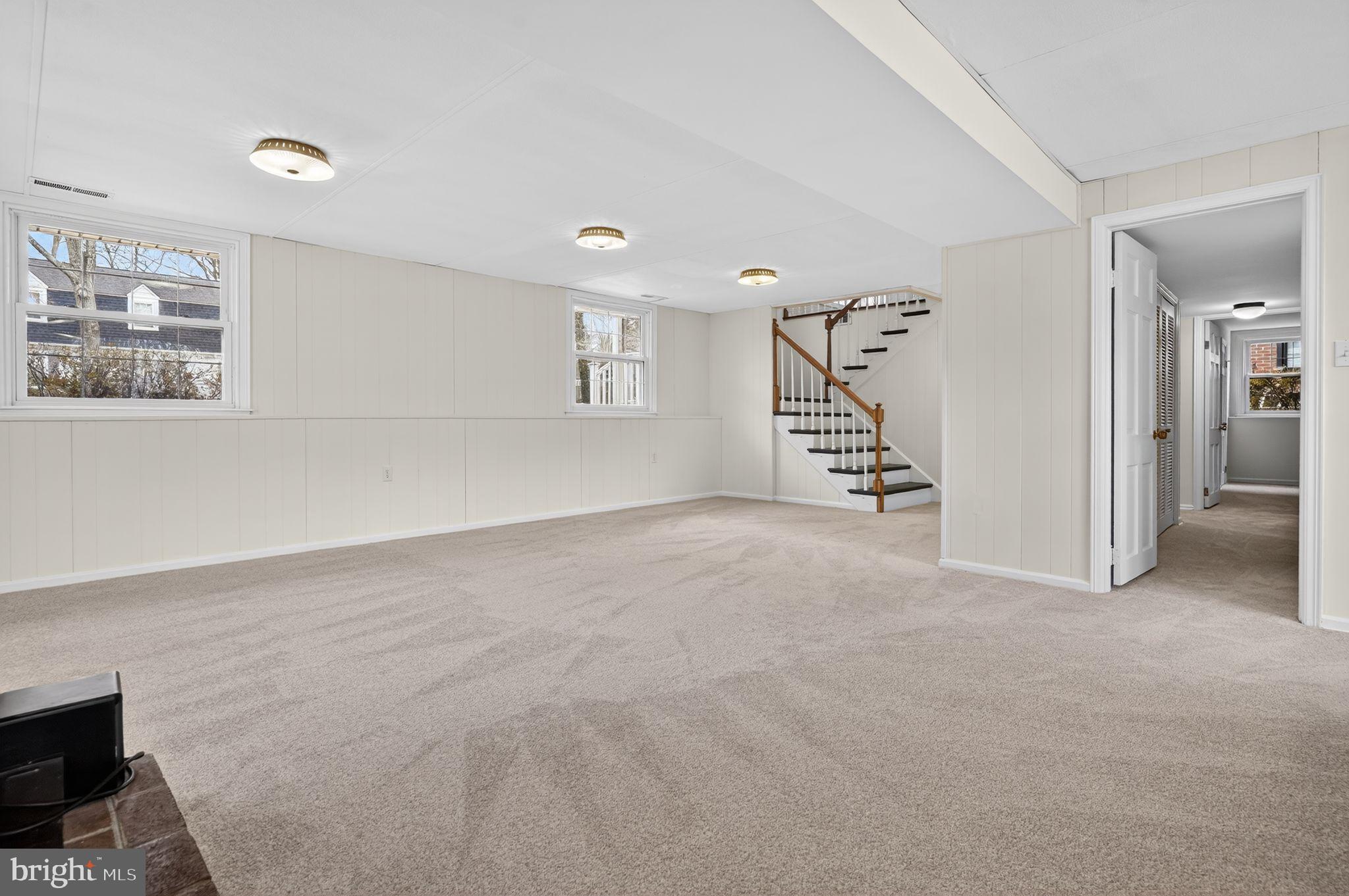 1629 Eton Way Crofton, MD 21114 - Photo 28 of 46 a view of an empty room with stairs and a living room