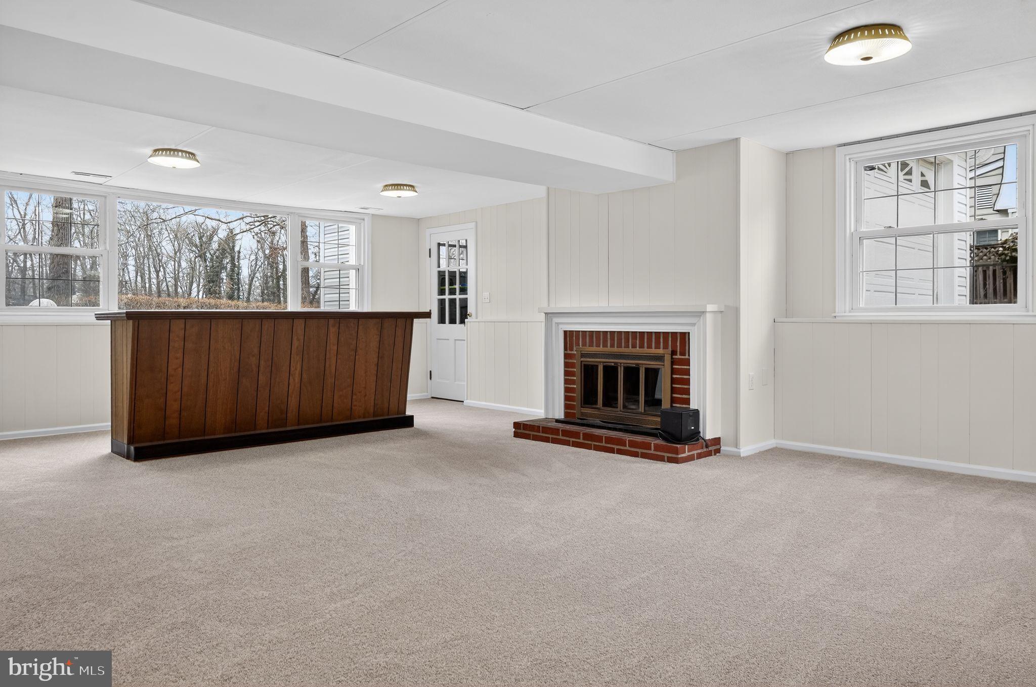 1629 Eton Way Crofton, MD 21114 - Photo 29 of 46 an empty room with furniture and fireplace