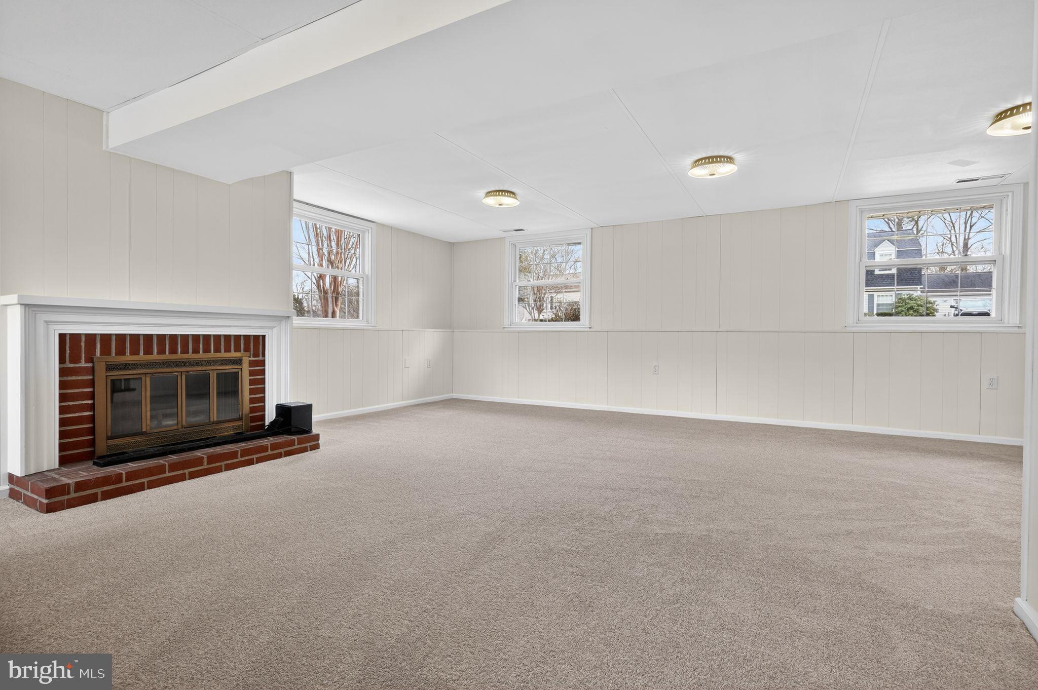 1629 Eton Way Crofton, MD 21114 - Photo 31 of 46 a view of empty room with a fireplace