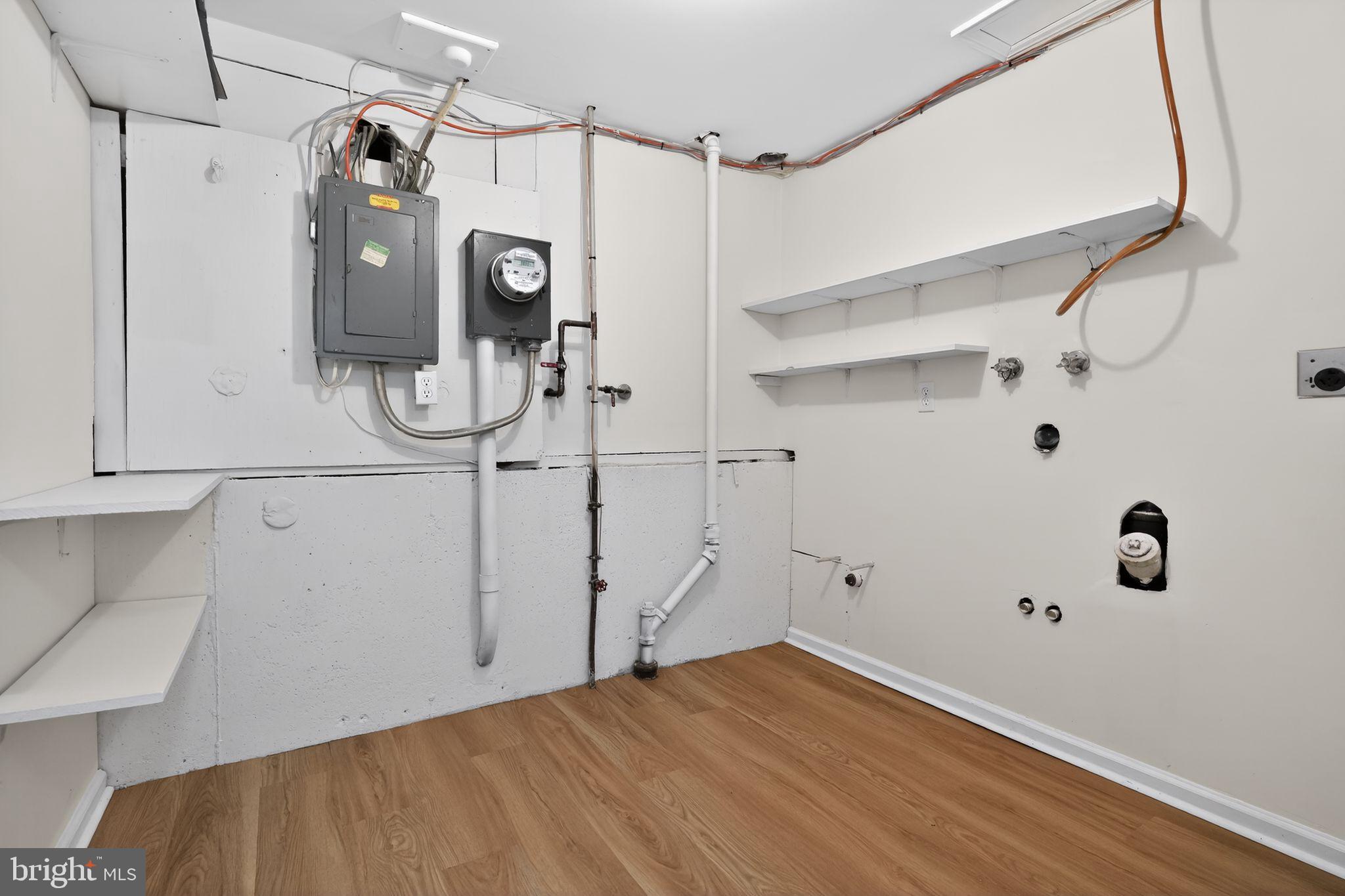 1629 Eton Way Crofton, MD 21114 - Photo 37 of 46 a view of a room with wooden floor and white walls