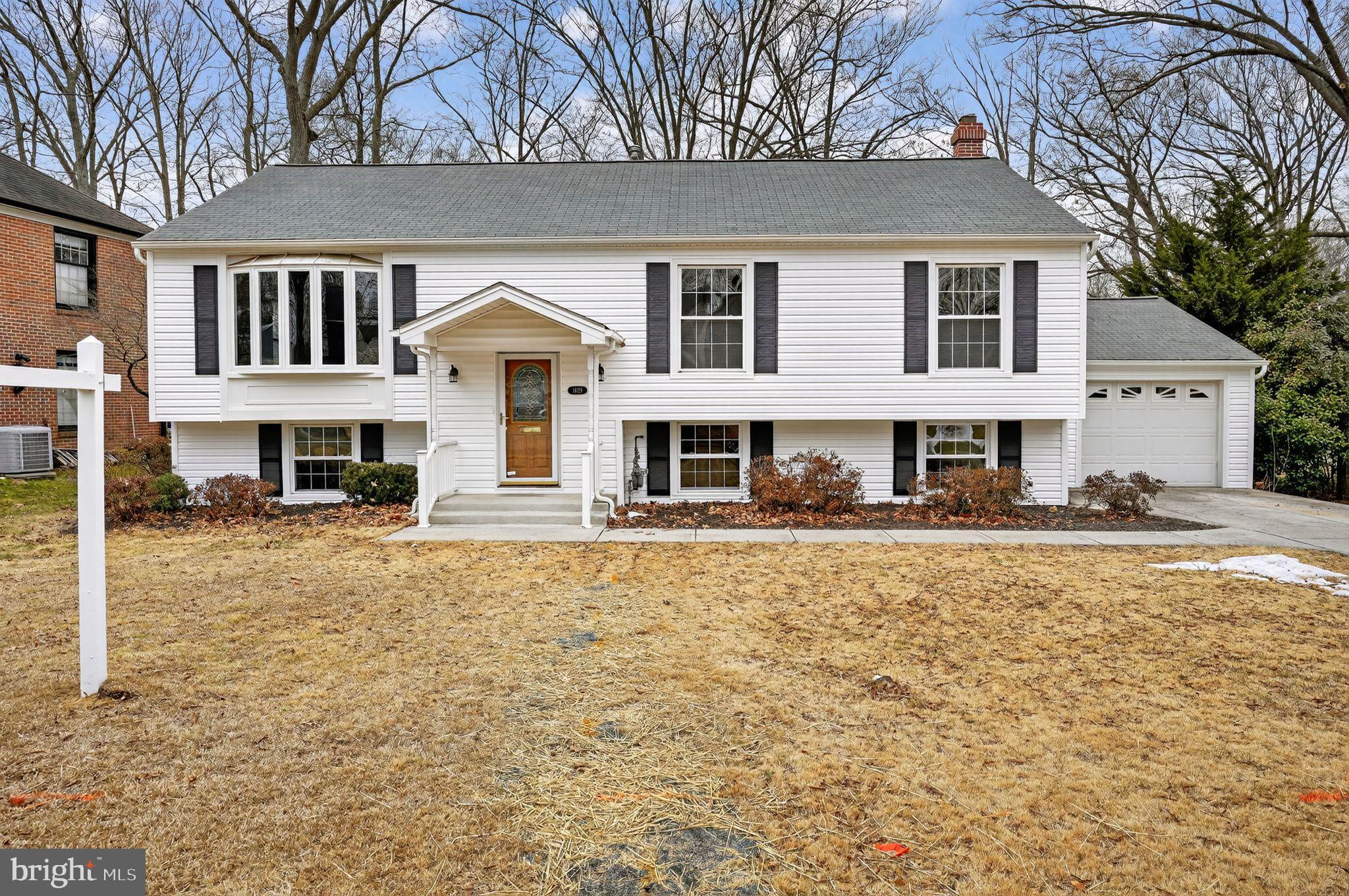 1629 Eton Way Crofton, MD 21114 - Photo 4 of 46 a front view of a house with a yard