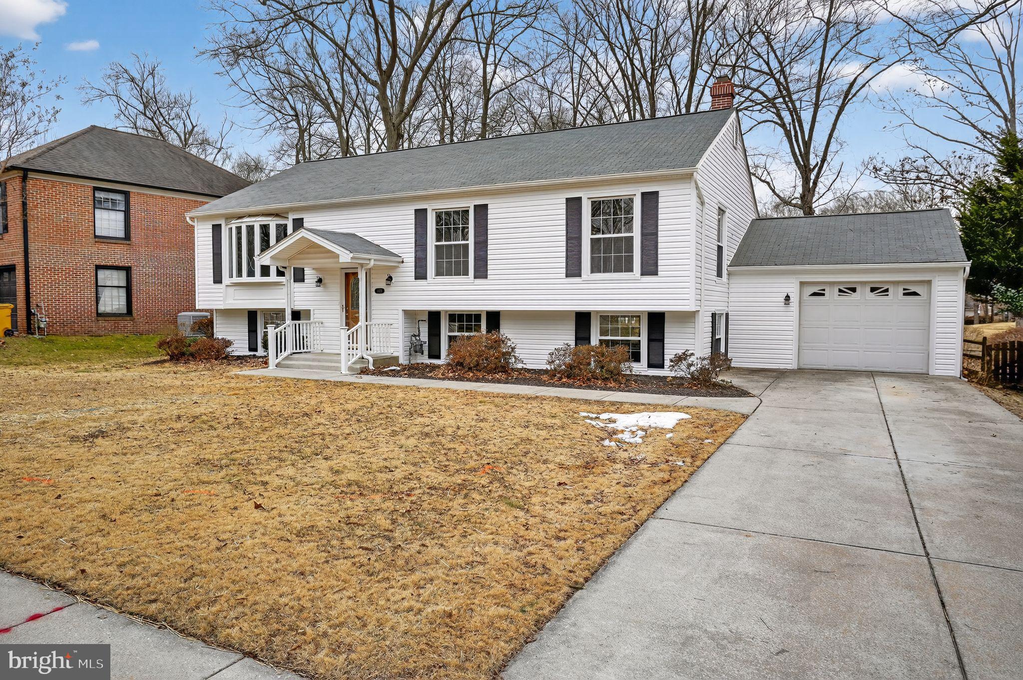 1629 Eton Way Crofton, MD 21114 - Photo 5 of 46 a front view of a house with a yard