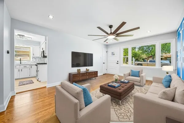 a living room with furniture and a flat screen tv
