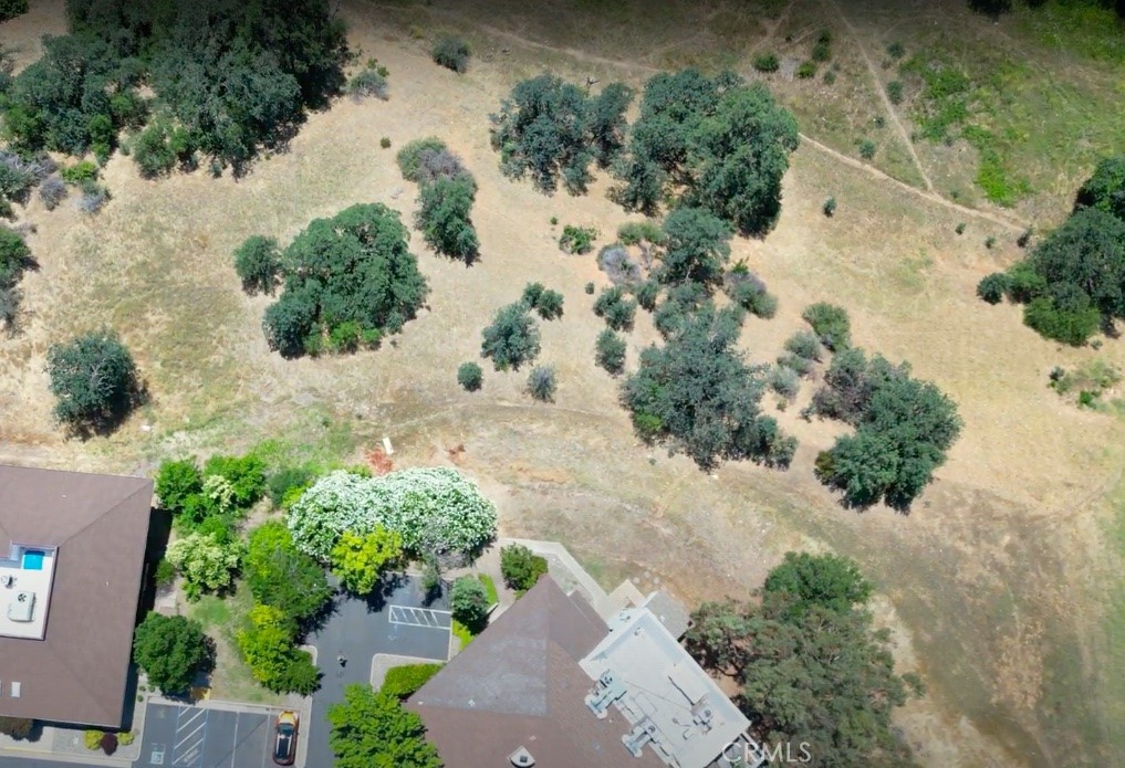 an aerial view of a house with a yard covered in it