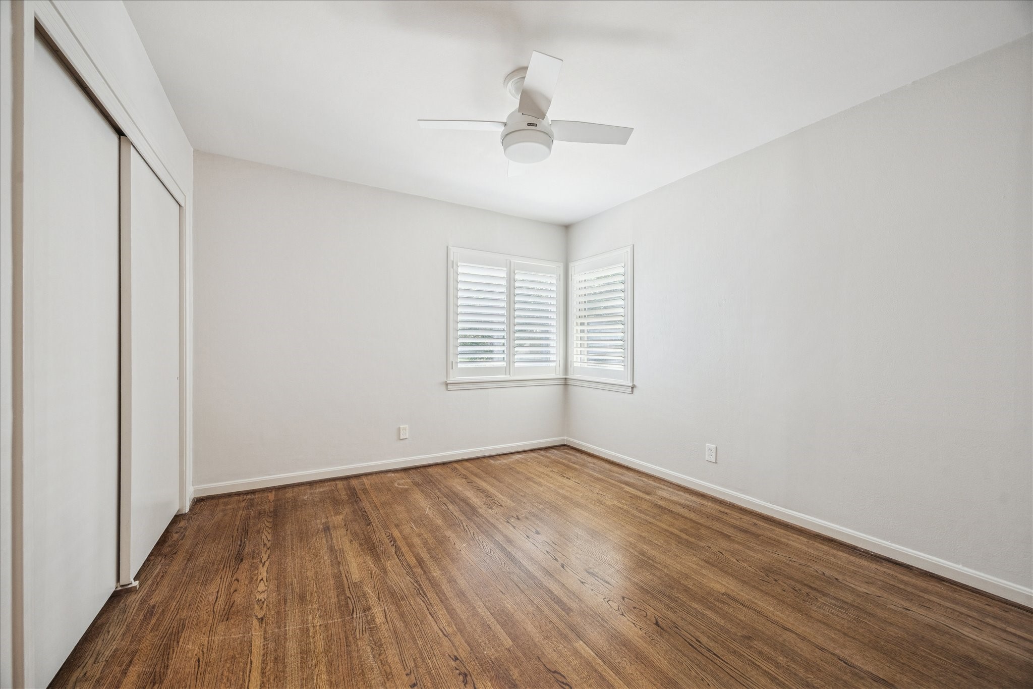 547 3 Corners Drive Hunters Creek Village, TX 77024 - Photo 11 of 17 wooden floor in an empty room with a window