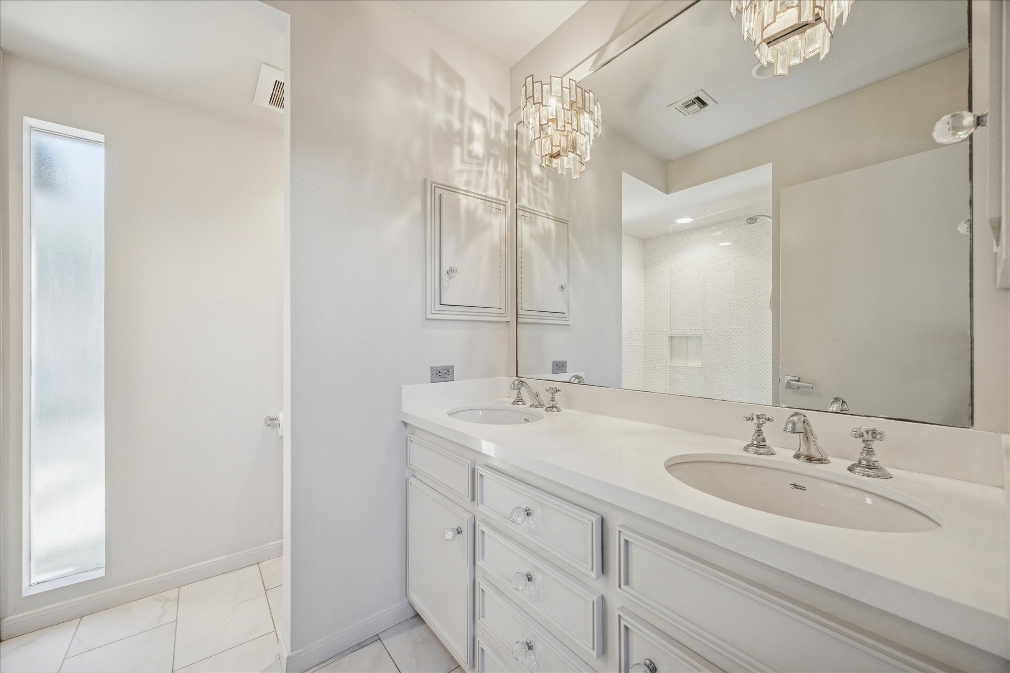 547 3 Corners Drive Hunters Creek Village, TX 77024 - Photo 12 of 17 a bathroom with 2 sink and a mirror