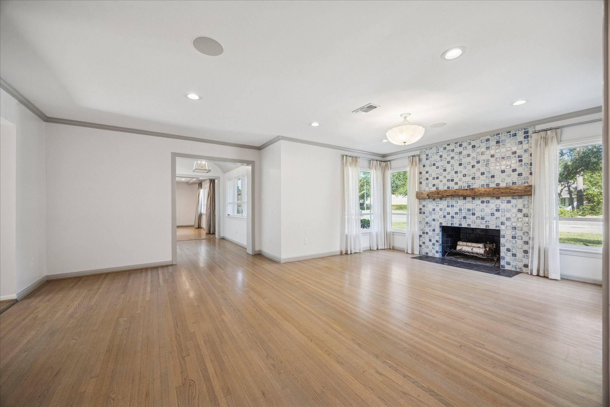 547 3 Corners Drive Hunters Creek Village, TX 77024 - Photo 6 of 17 a view of an empty room with a fireplace and a window
