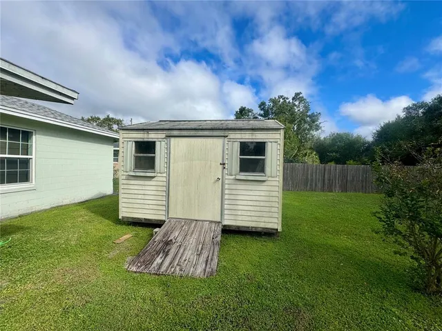a view of a back yard of the house