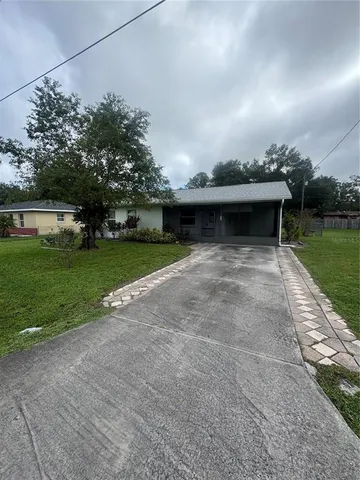 a view of house with outdoor space and pathway