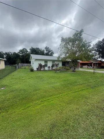 a view of a house with a big yard