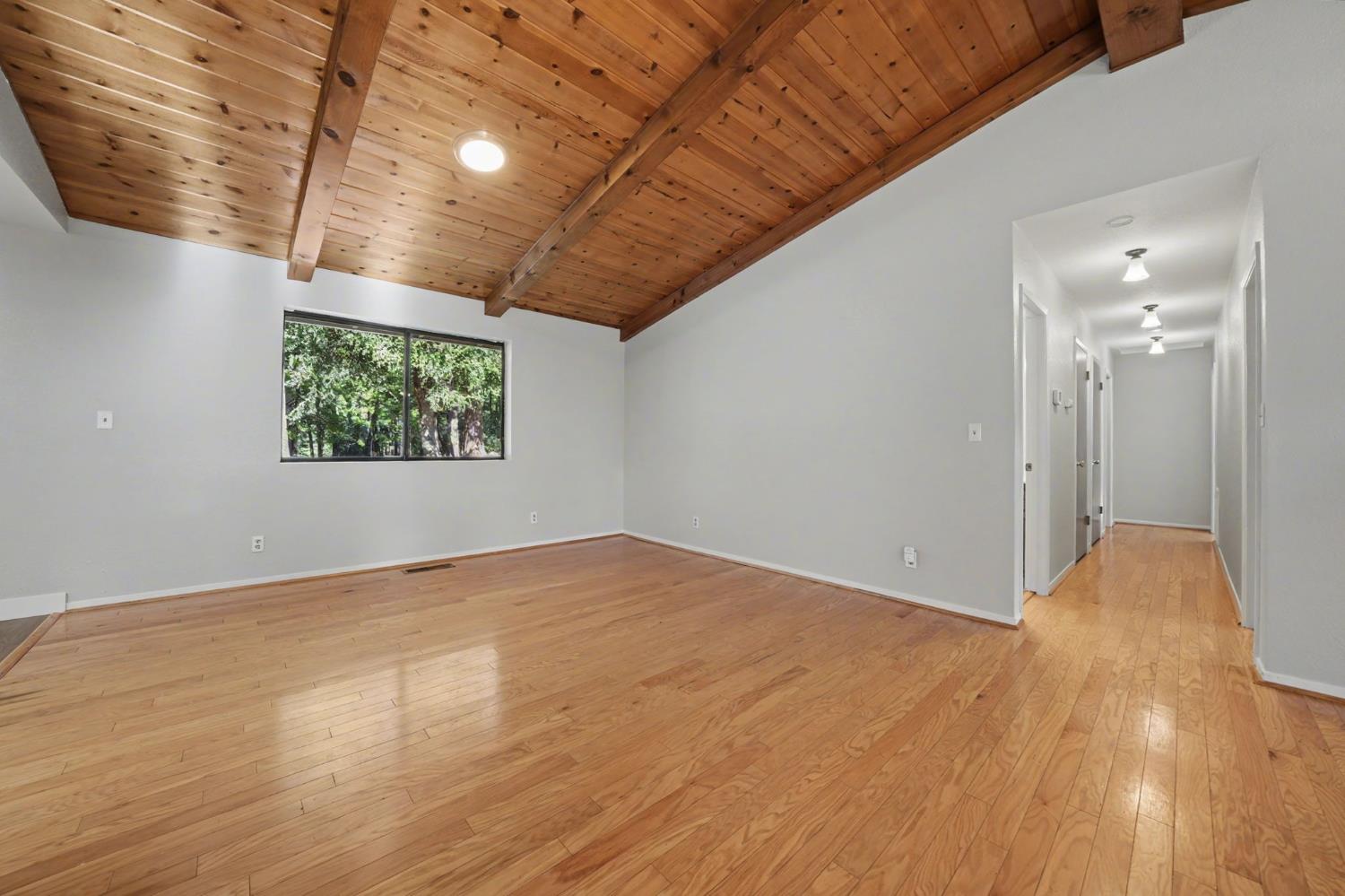 23781 Golden Ridge Drive Volcano, CA 95689 - Photo 14 of 50 a view of empty room with wooden floor