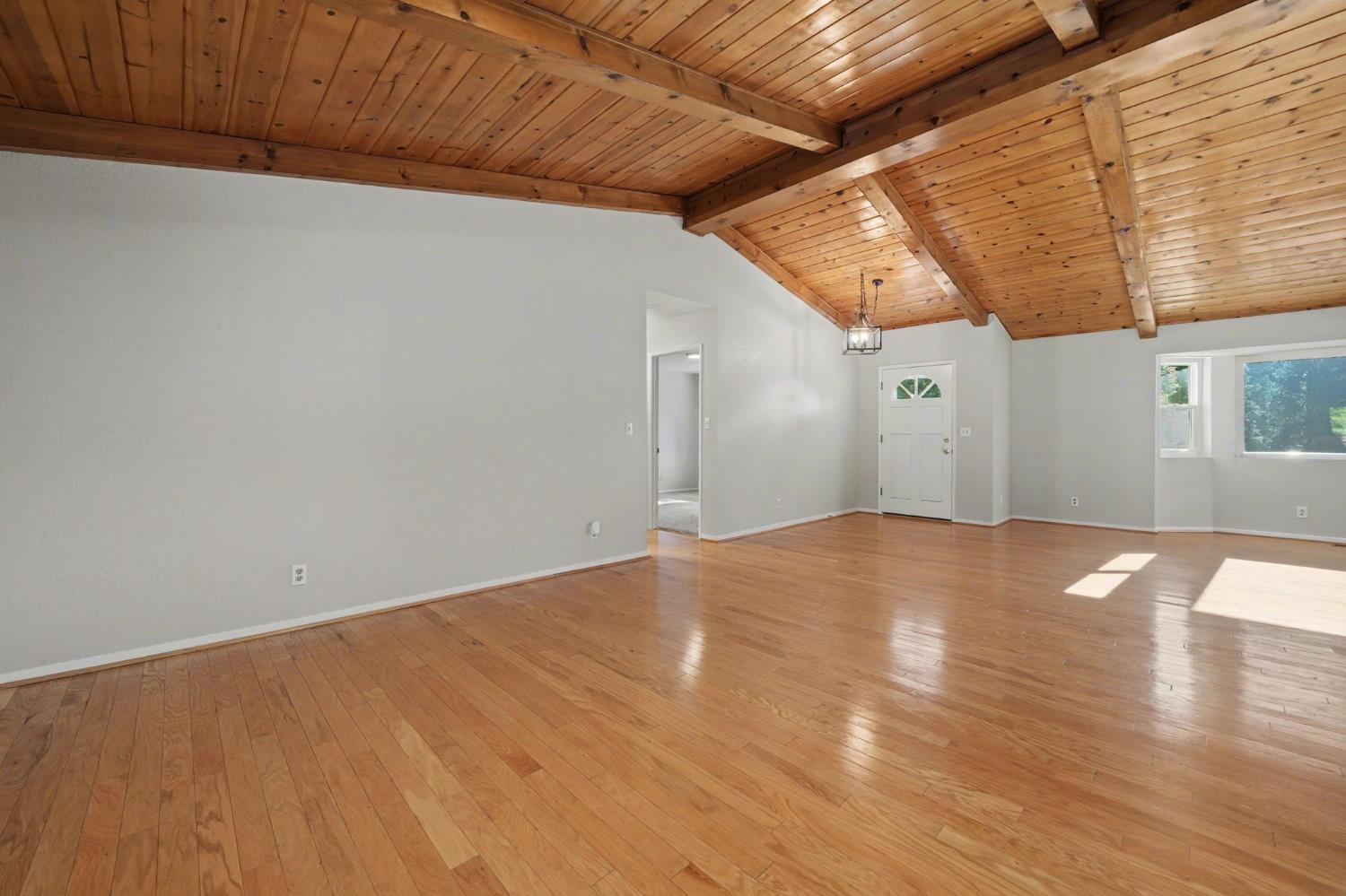 23781 Golden Ridge Drive Volcano, CA 95689 - Photo 18 of 50 a view of empty room with wooden floor