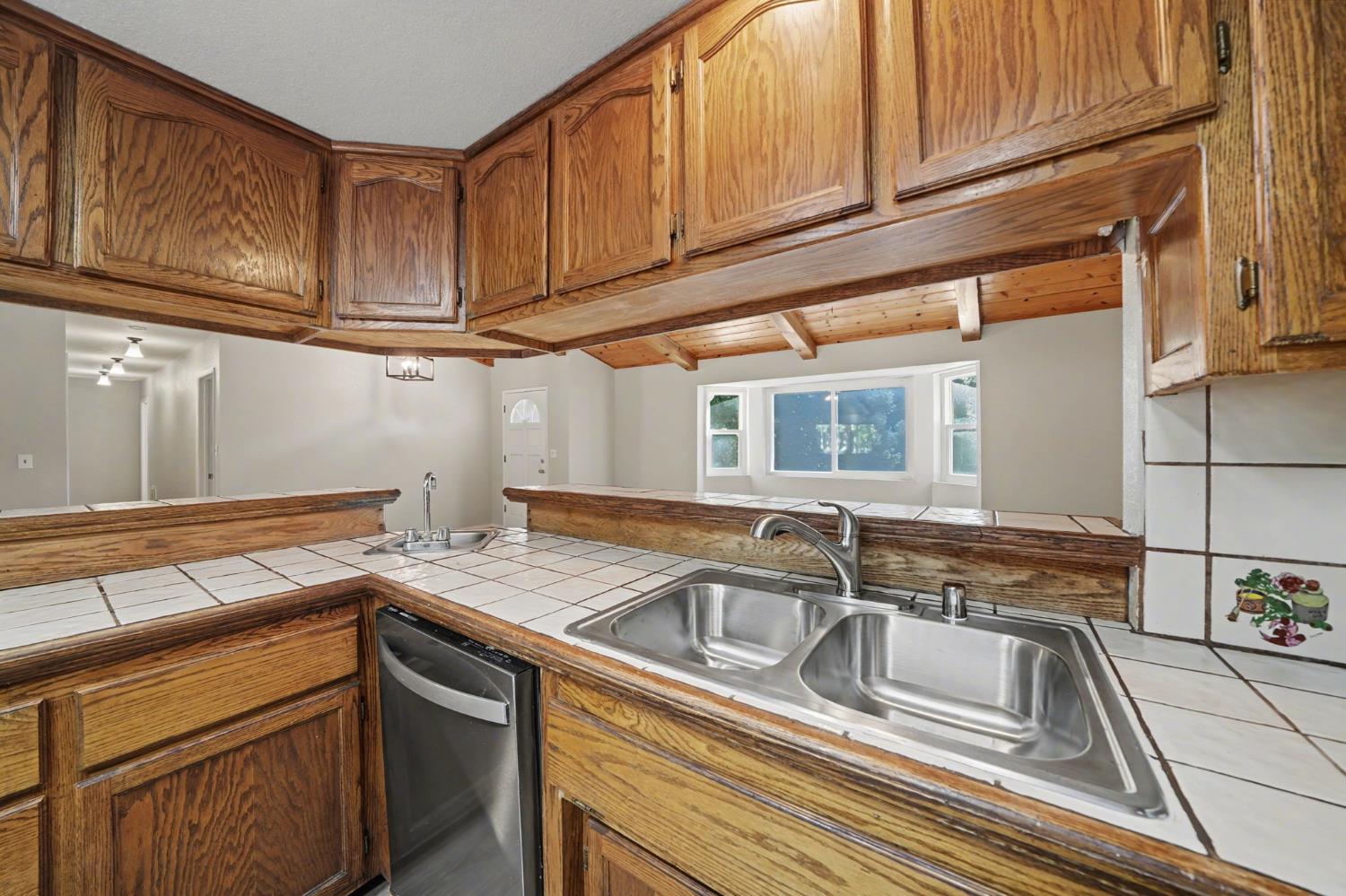 23781 Golden Ridge Drive Volcano, CA 95689 - Photo 23 of 50 a view of a kitchen sink stove and cabinets