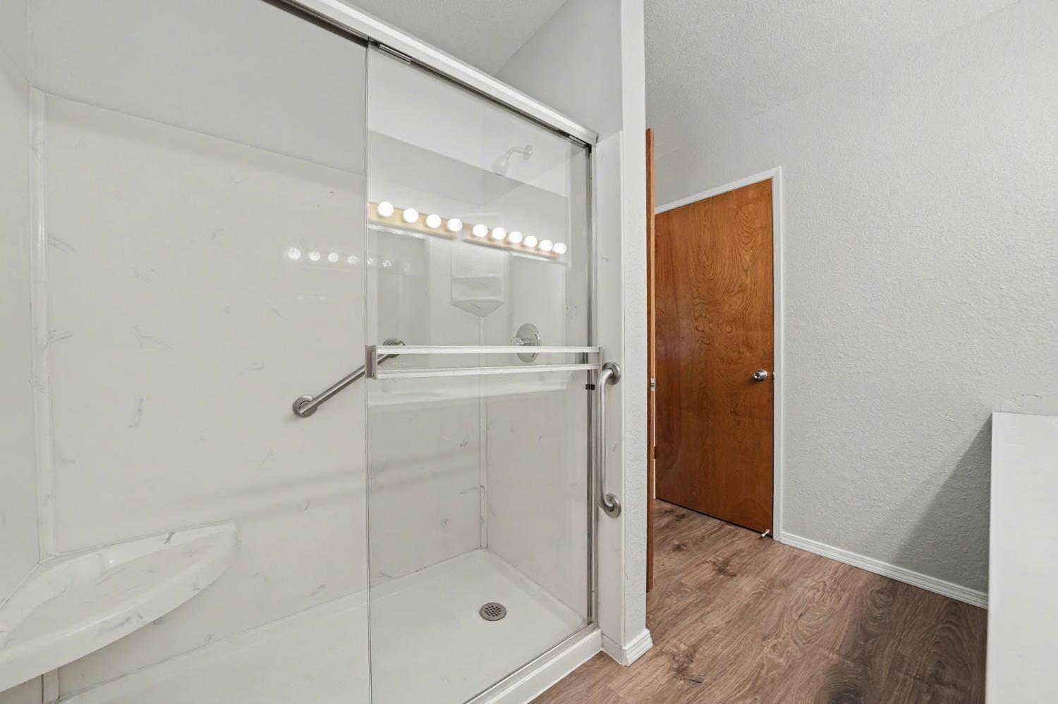 23781 Golden Ridge Drive Volcano, CA 95689 - Photo 30 of 50 a bathroom with a glass shower door