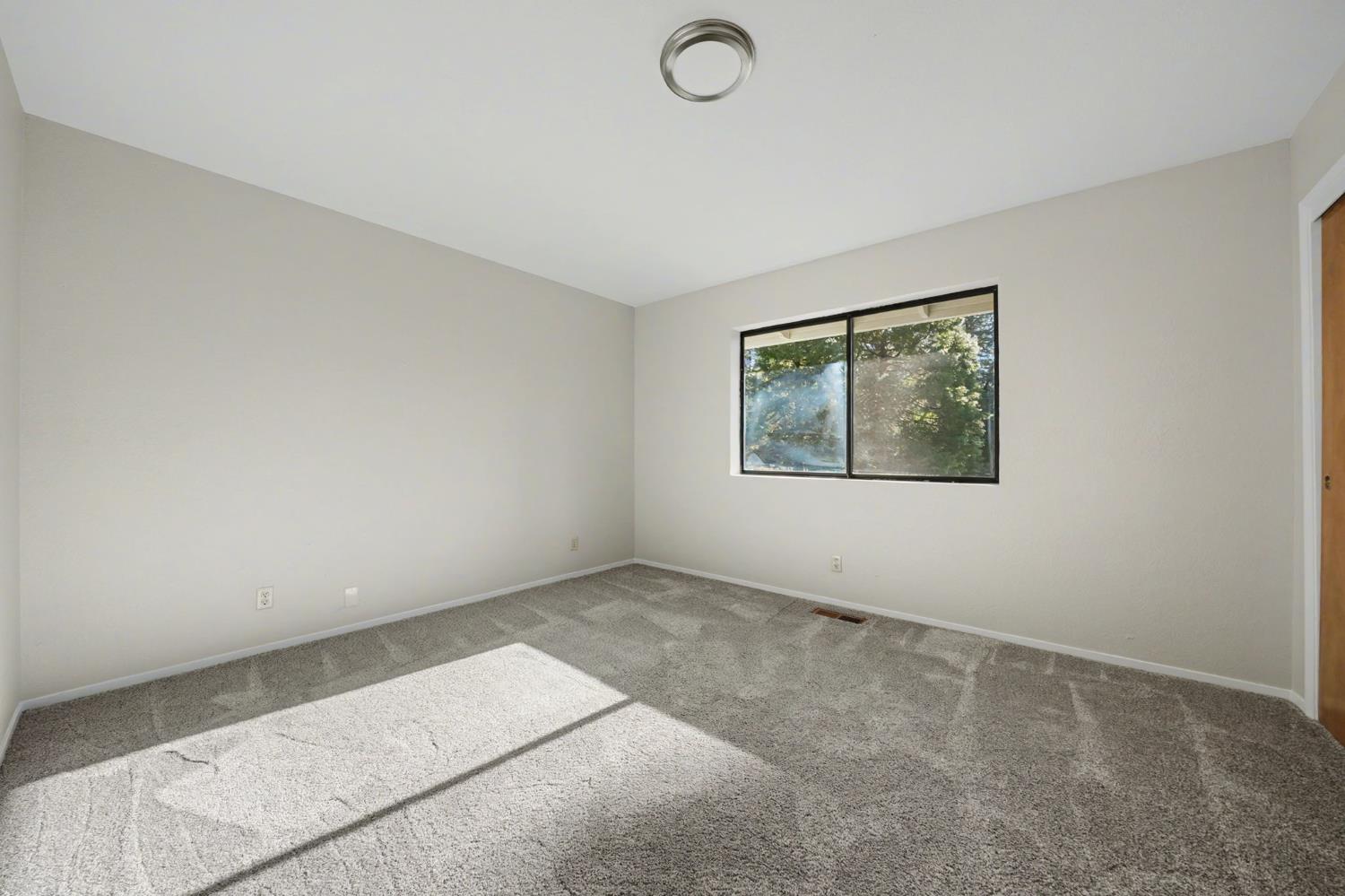 23781 Golden Ridge Drive Volcano, CA 95689 - Photo 32 of 50 an empty room with windows