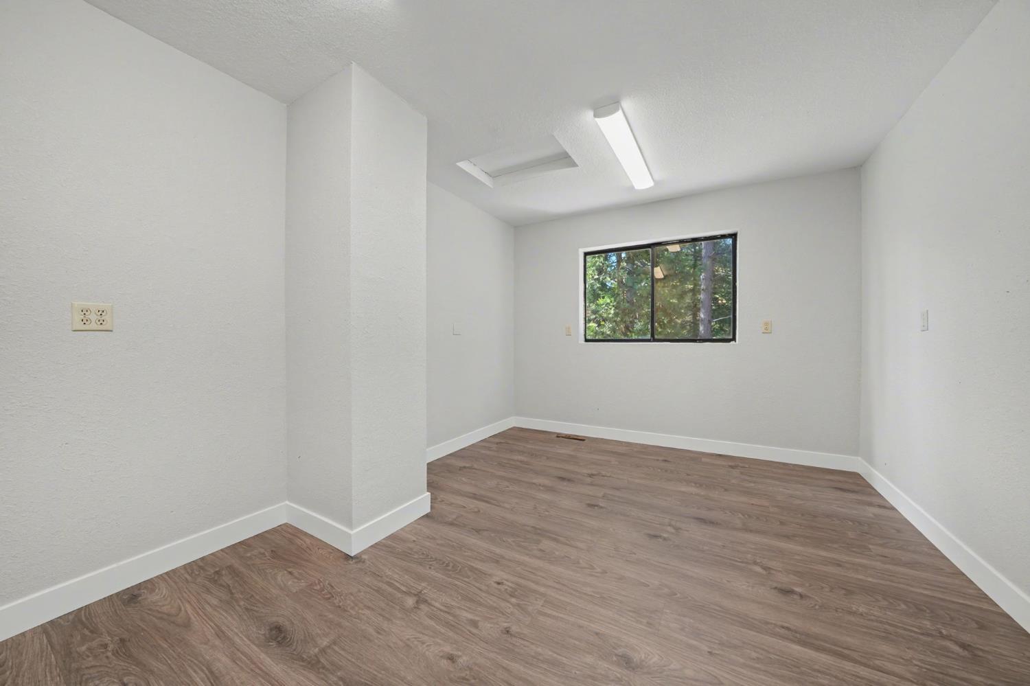 23781 Golden Ridge Drive Volcano, CA 95689 - Photo 41 of 50 wooden floor in an empty room with a window