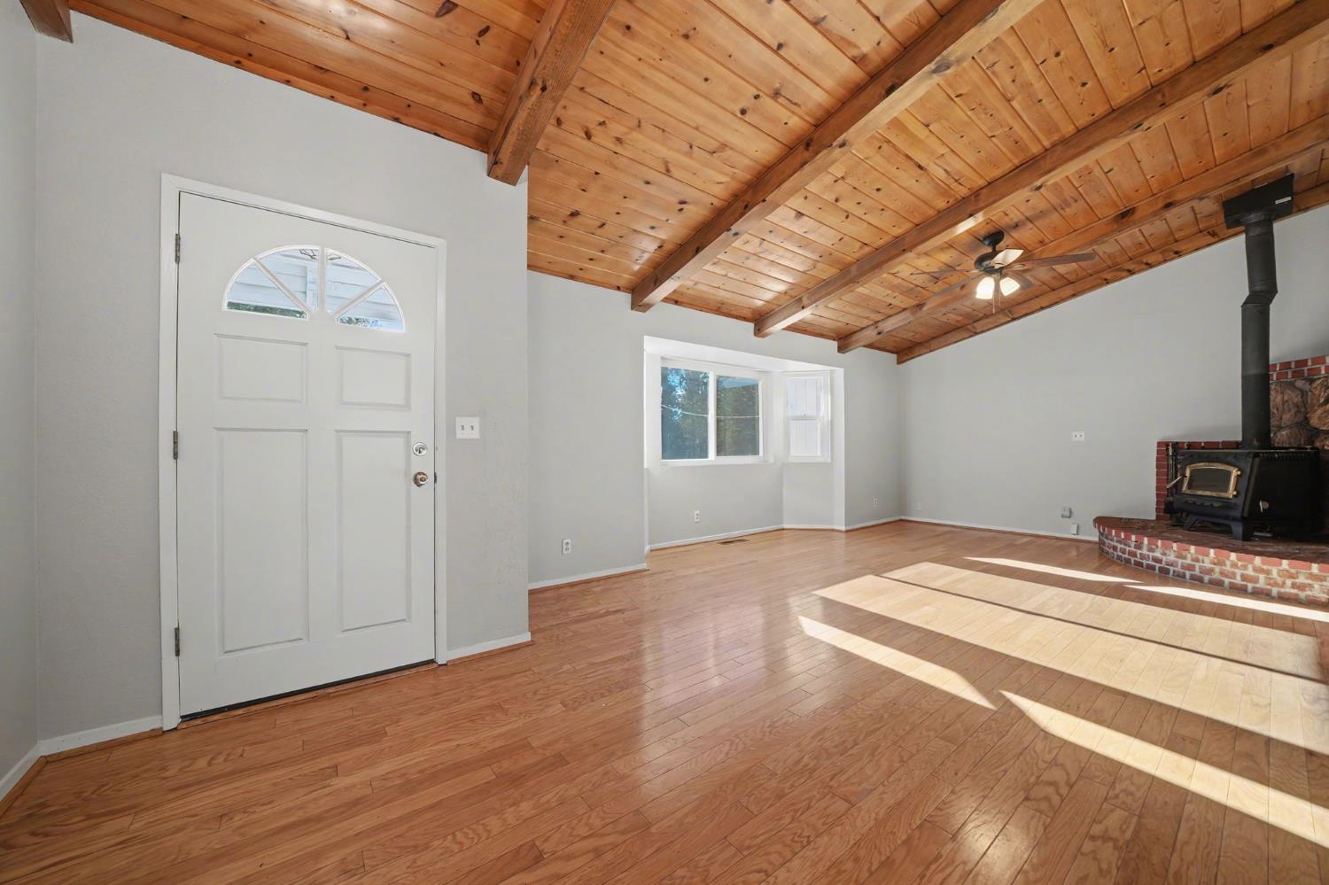 23781 Golden Ridge Drive Volcano, CA 95689 - Photo 9 of 50 a bedroom with a bed and a chandelier