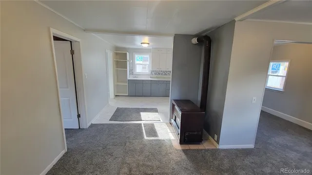 a view of entryway with hallway and stairs