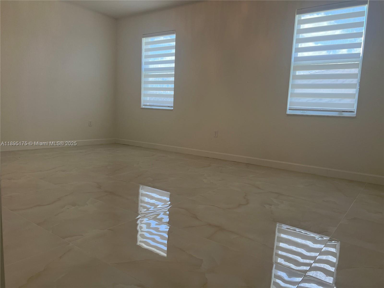 16960 Southwest 288th Terrace, Unit 16960 Homestead, FL 33033 - Photo 14 of 33 a view of room and window