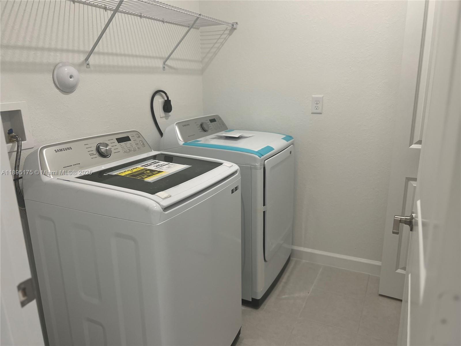 16960 Southwest 288th Terrace, Unit 16960 Homestead, FL 33033 - Photo 18 of 33 a utility room with dryer and washer