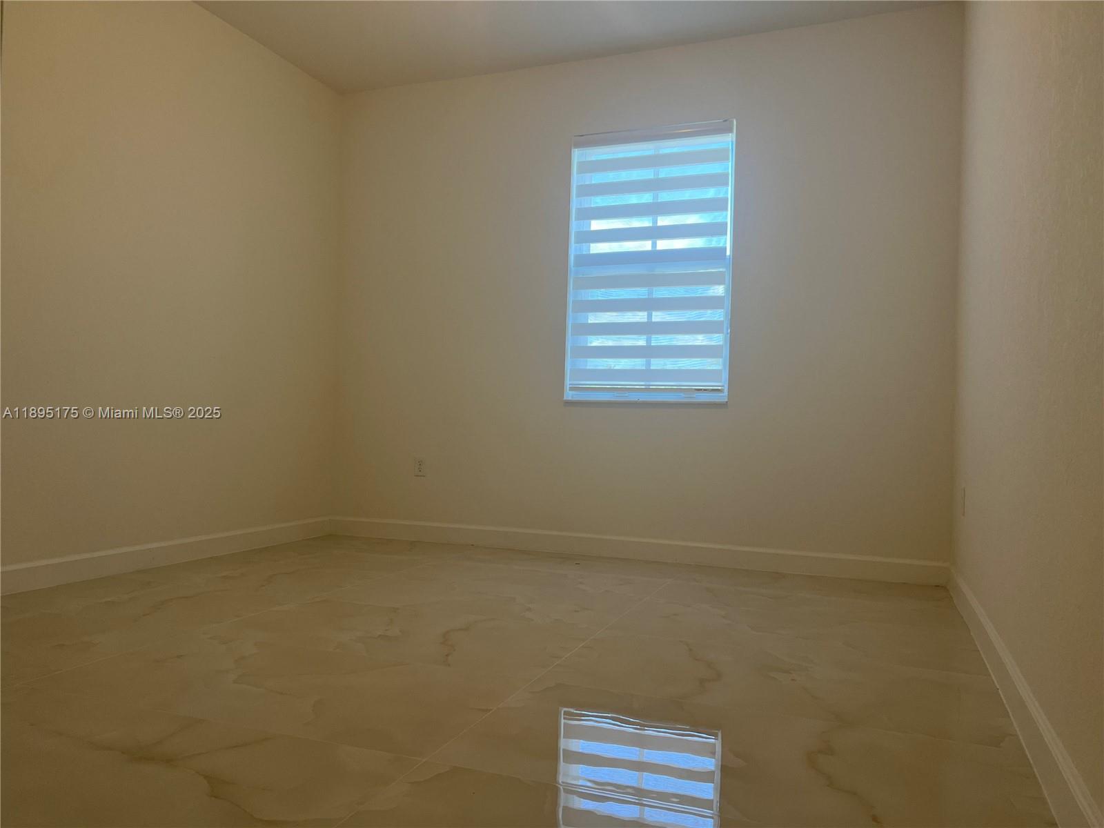 16960 Southwest 288th Terrace, Unit 16960 Homestead, FL 33033 - Photo 22 of 33 a view of room and window