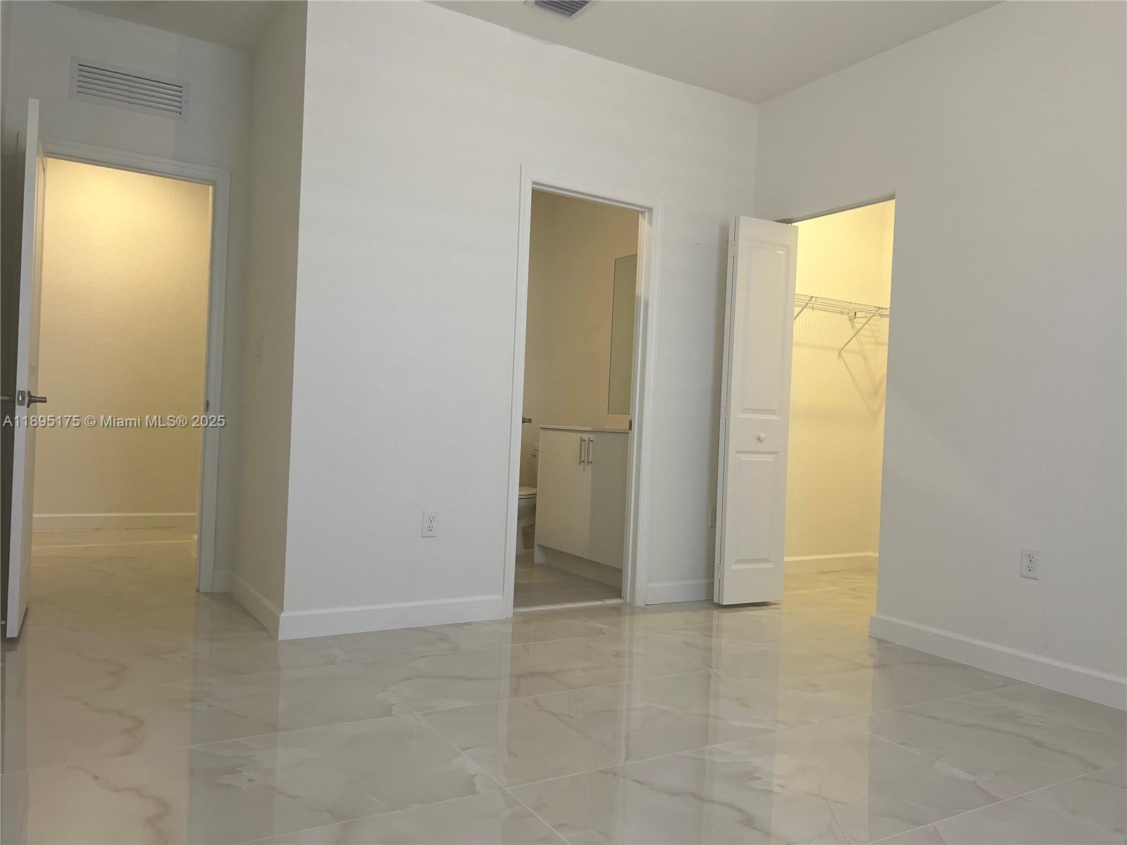 16960 Southwest 288th Terrace, Unit 16960 Homestead, FL 33033 - Photo 23 of 33 a view of an empty room