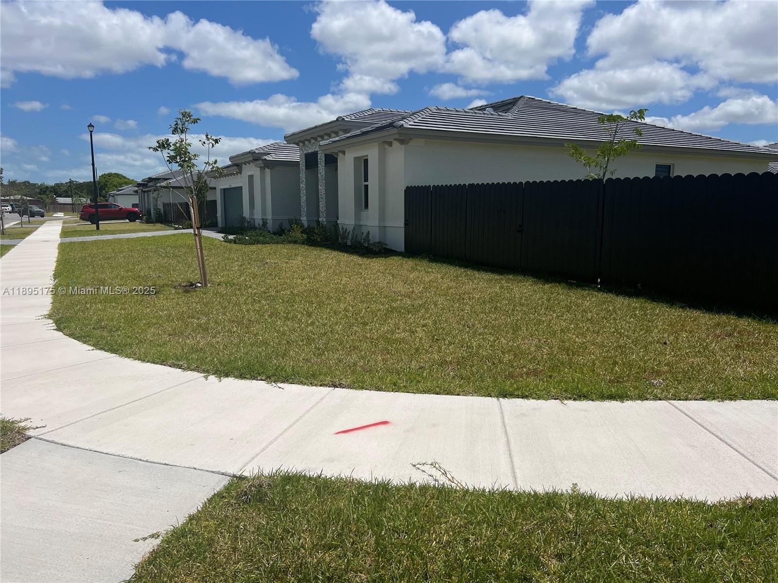 16960 Southwest 288th Terrace, Unit 16960 Homestead, FL 33033 - Photo 30 of 33 a view of a garden