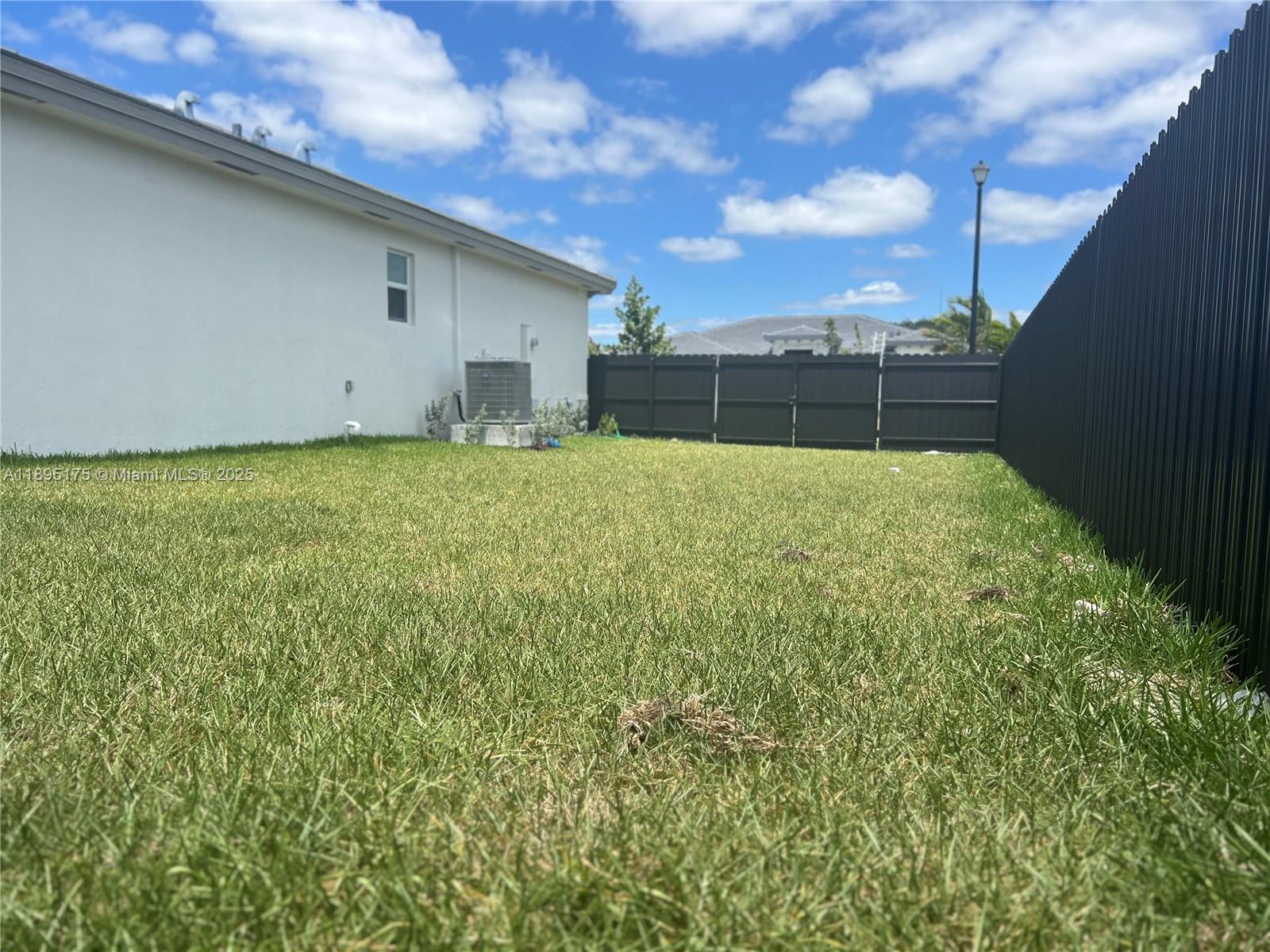 16960 Southwest 288th Terrace, Unit 16960 Homestead, FL 33033 - Photo 32 of 33 a view of outdoor space and yard