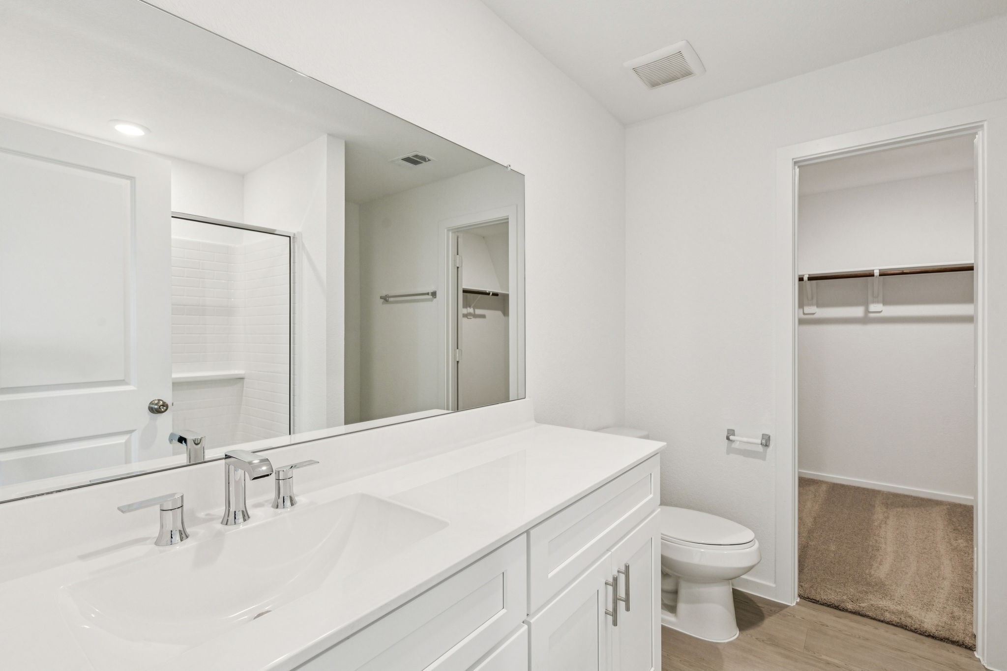 16148 Sepia Manor Street Conroe, TX 77302 - Photo 18 of 32 a bathroom with a sink a toilet and shower