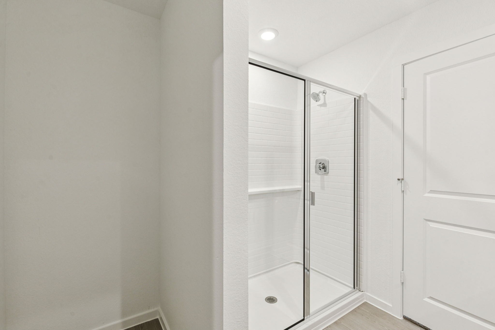 16148 Sepia Manor Street Conroe, TX 77302 - Photo 19 of 32 a bathroom with a shower and a glass door