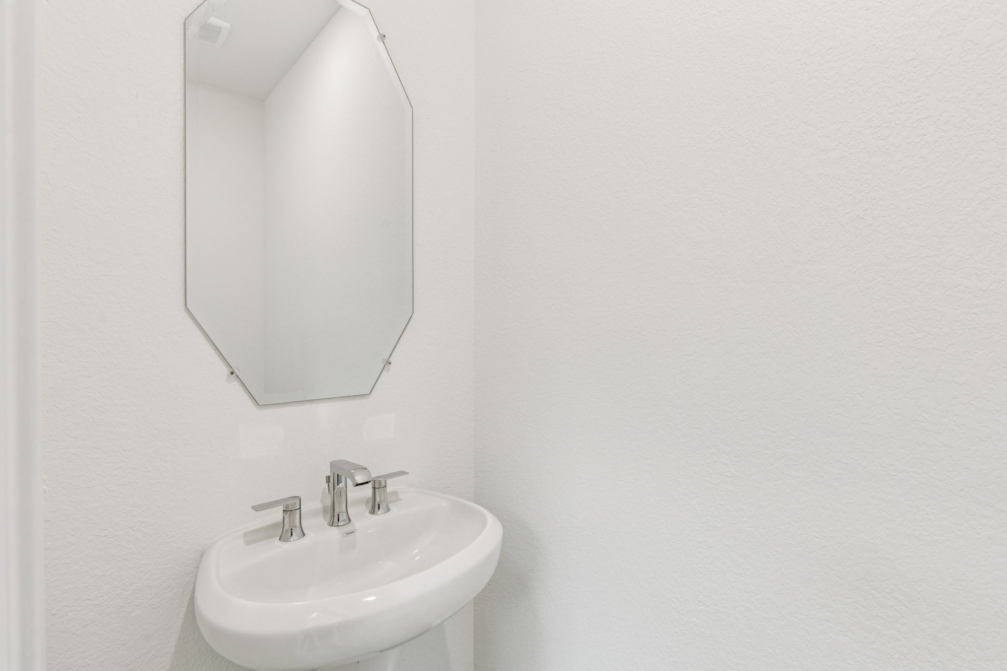 16148 Sepia Manor Street Conroe, TX 77302 - Photo 4 of 32 a bathroom with a sink and a mirror