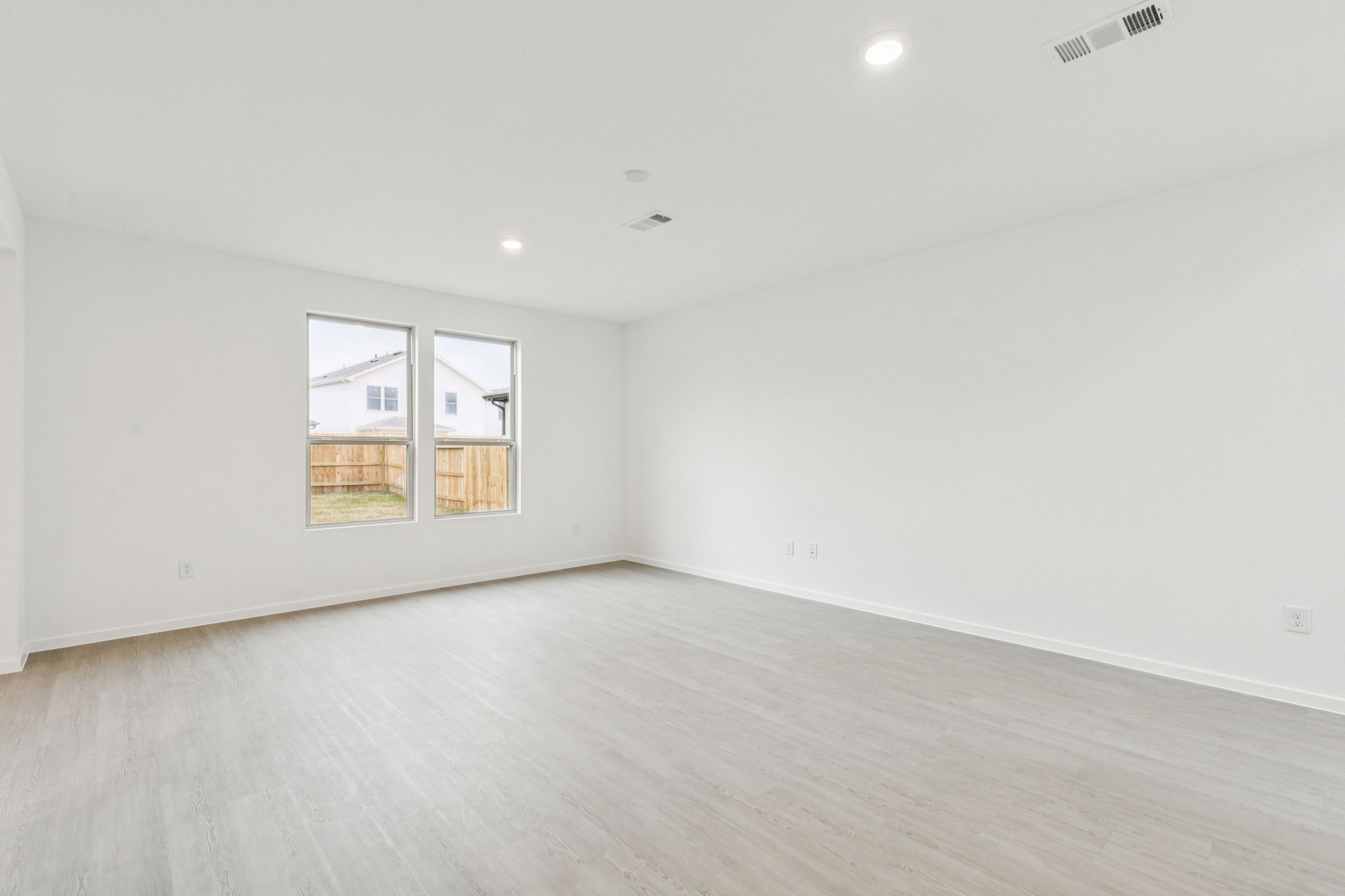 16148 Sepia Manor Street Conroe, TX 77302 - Photo 6 of 32 an empty room with windows