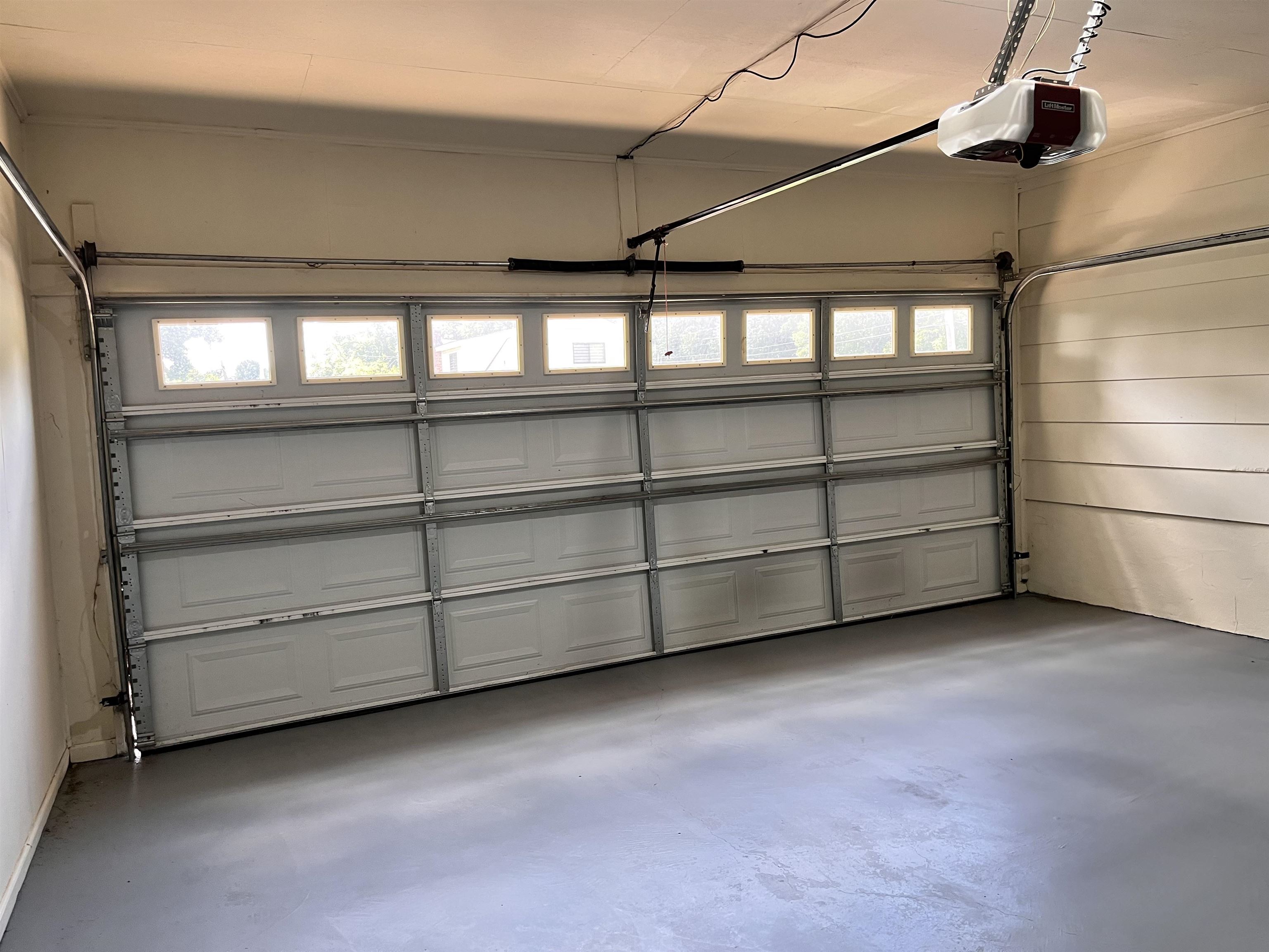 4282 Millbranch Road Memphis, TN 38116 - Photo 23 of 28 Garage featuring a garage door opener