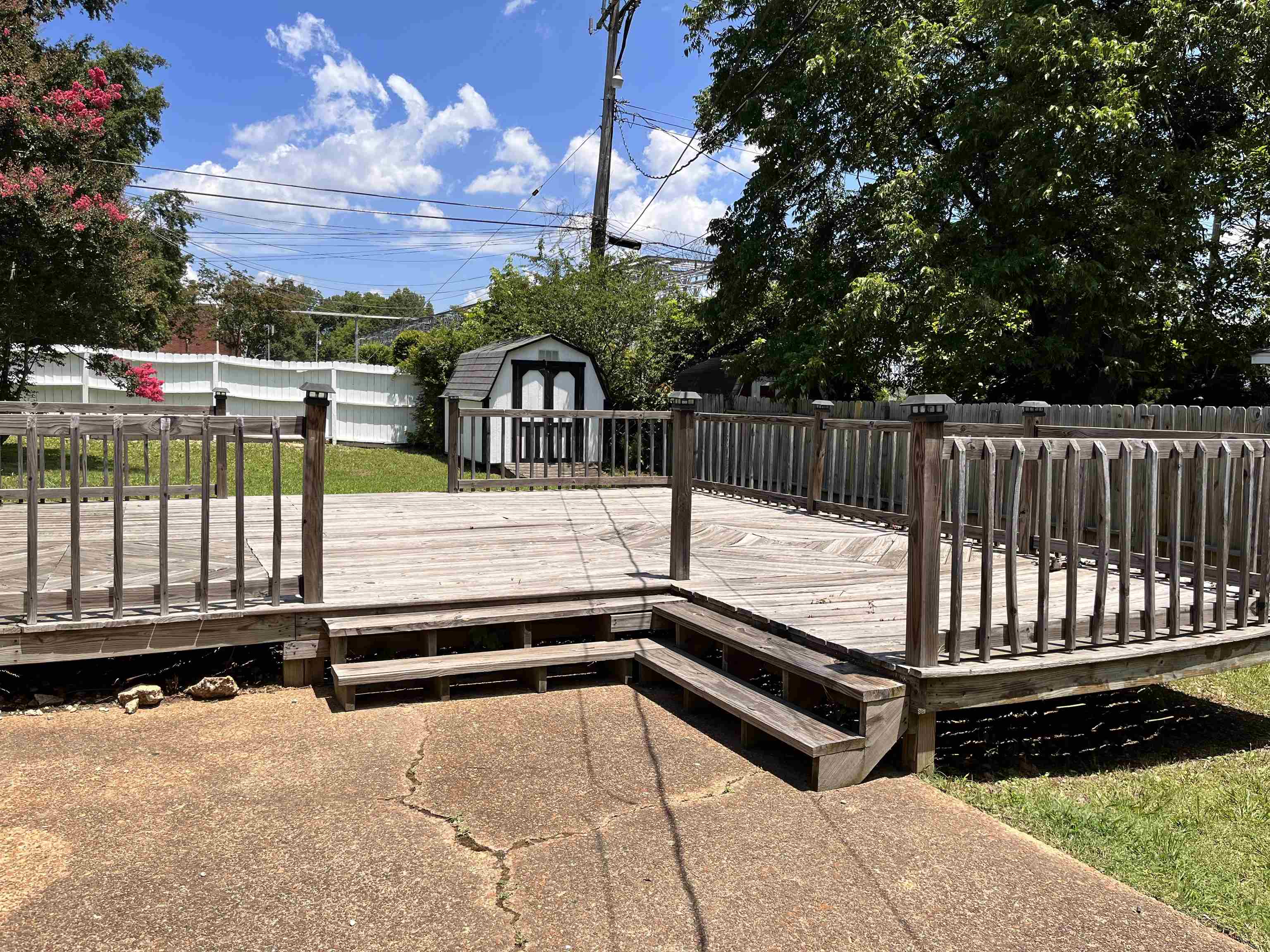 4282 Millbranch Road Memphis, TN 38116 - Photo 24 of 28 Wooden terrace featuring a storage unit and a fenced backyard