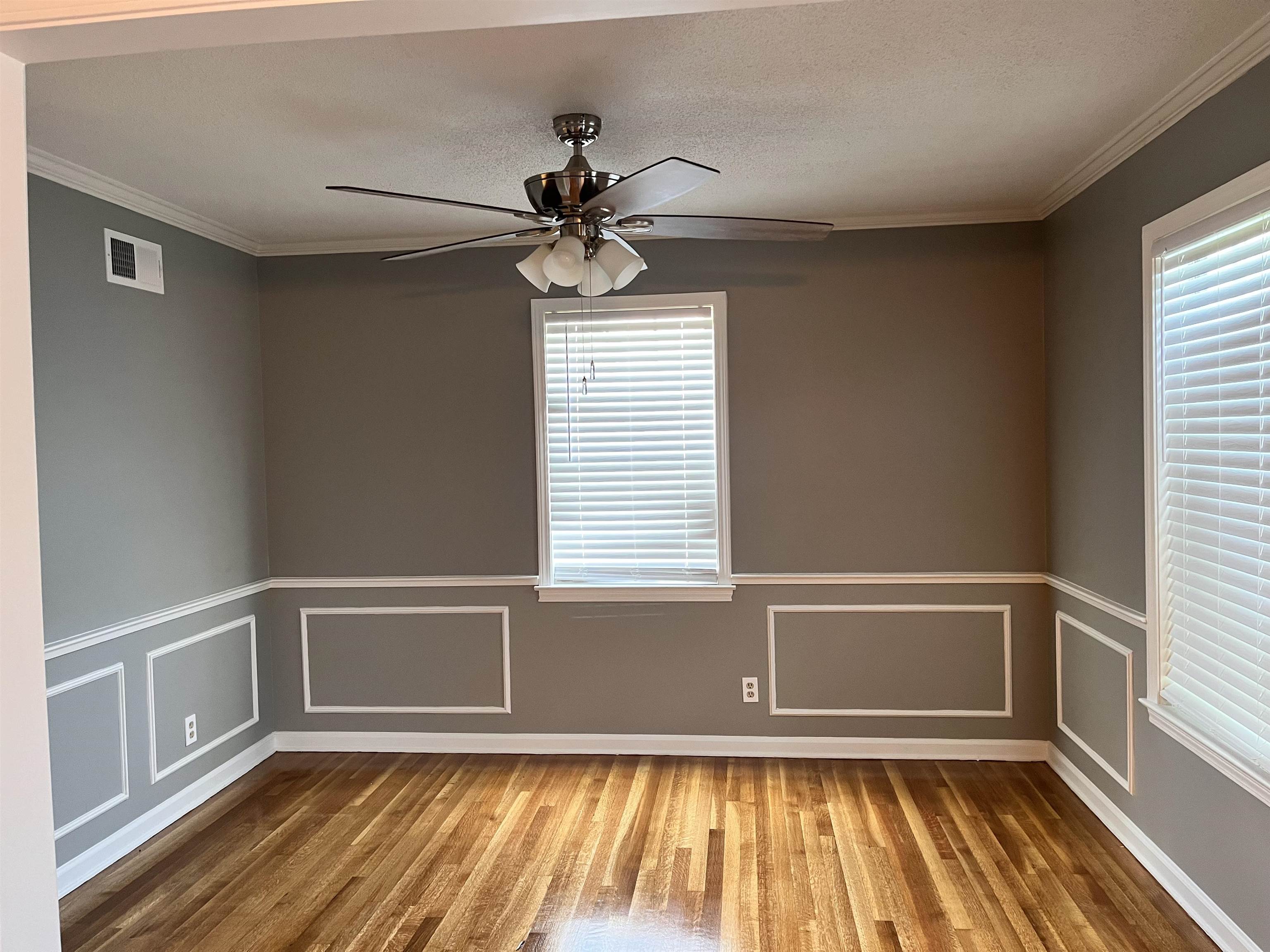 4282 Millbranch Road Memphis, TN 38116 - Photo 5 of 28 Spare room featuring wood finished floors, ceiling fan, and ornamental molding