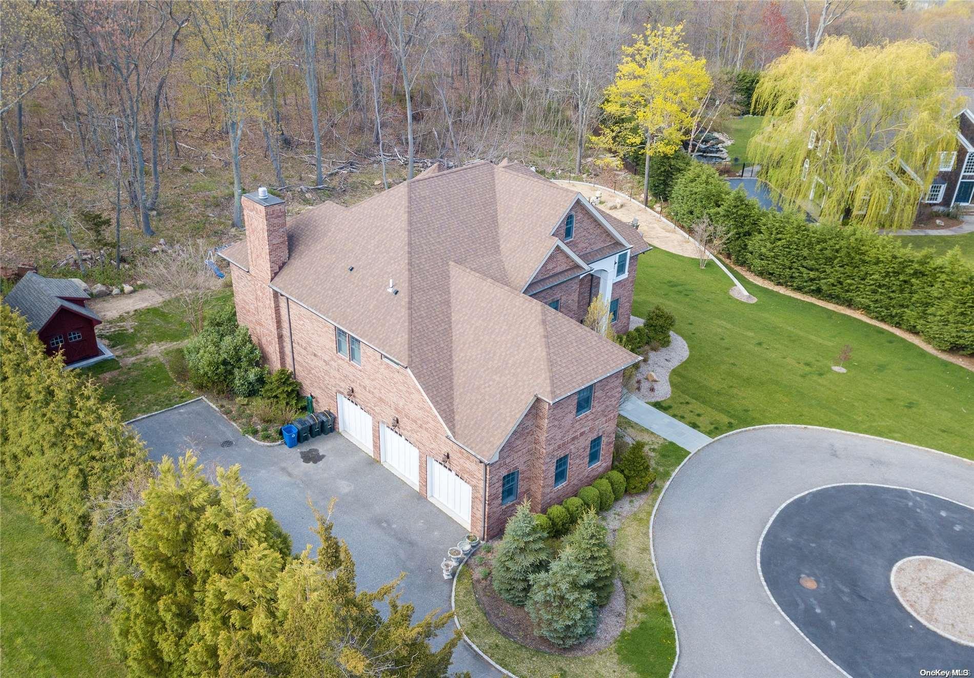 96 Shore Road Mount Sinai, NY 11766 - Photo 1 of 1 aerial view of a house with a yard and garden