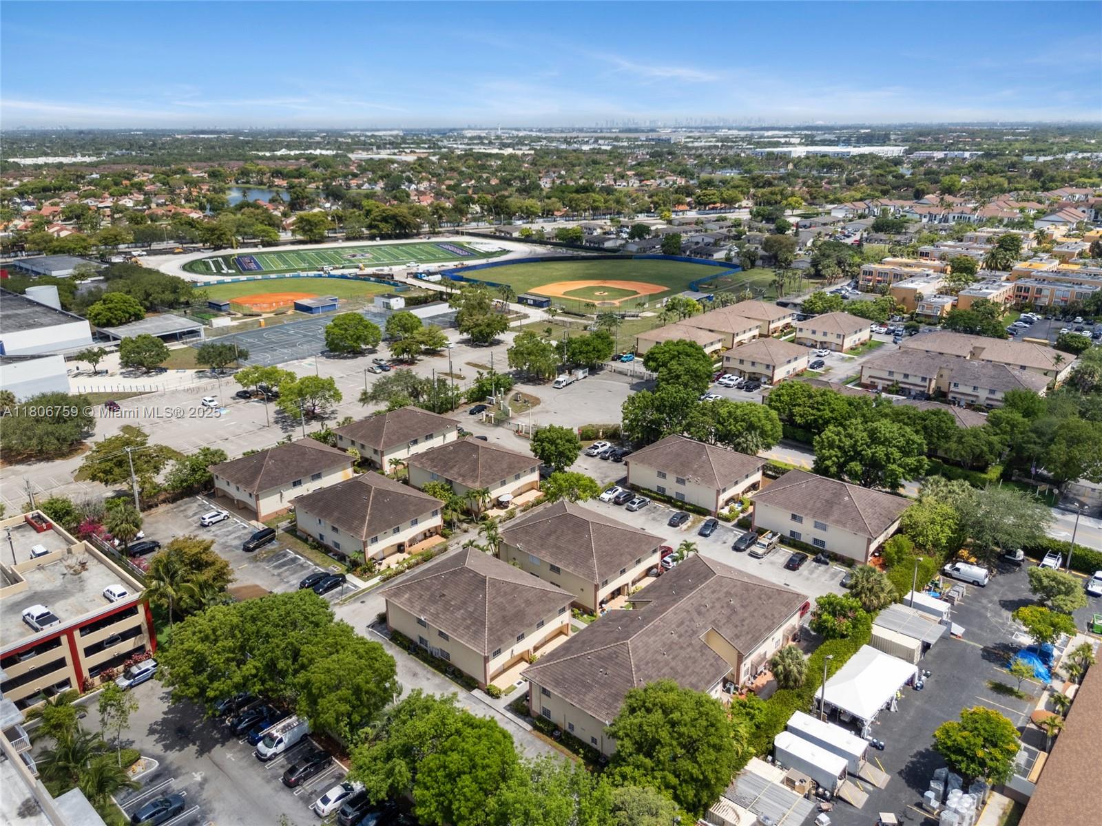 6755 Northwest 182nd Street, Unit 104 Hialeah, FL 33015 - Photo 11 of 33 an aerial view of residential houses with outdoor space