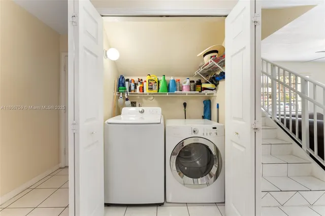 a utility room with dryer and washer