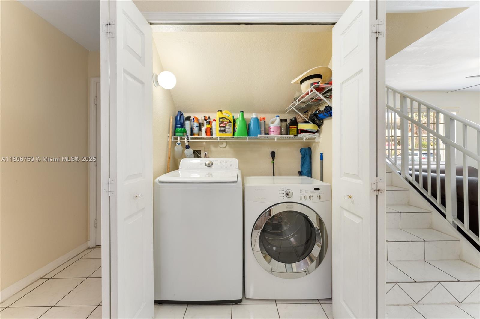 6755 Northwest 182nd Street, Unit 104 Hialeah, FL 33015 - Photo 27 of 33 a utility room with dryer and washer