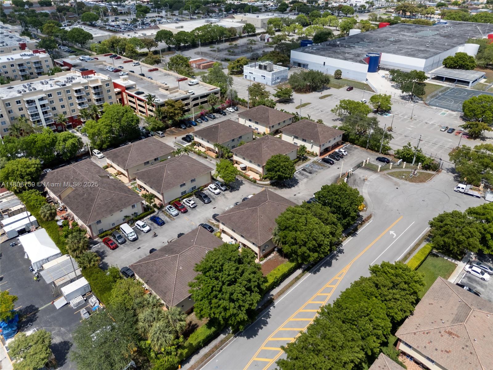 6755 Northwest 182nd Street, Unit 104 Hialeah, FL 33015 - Photo 29 of 33 an aerial view of residential houses with outdoor space