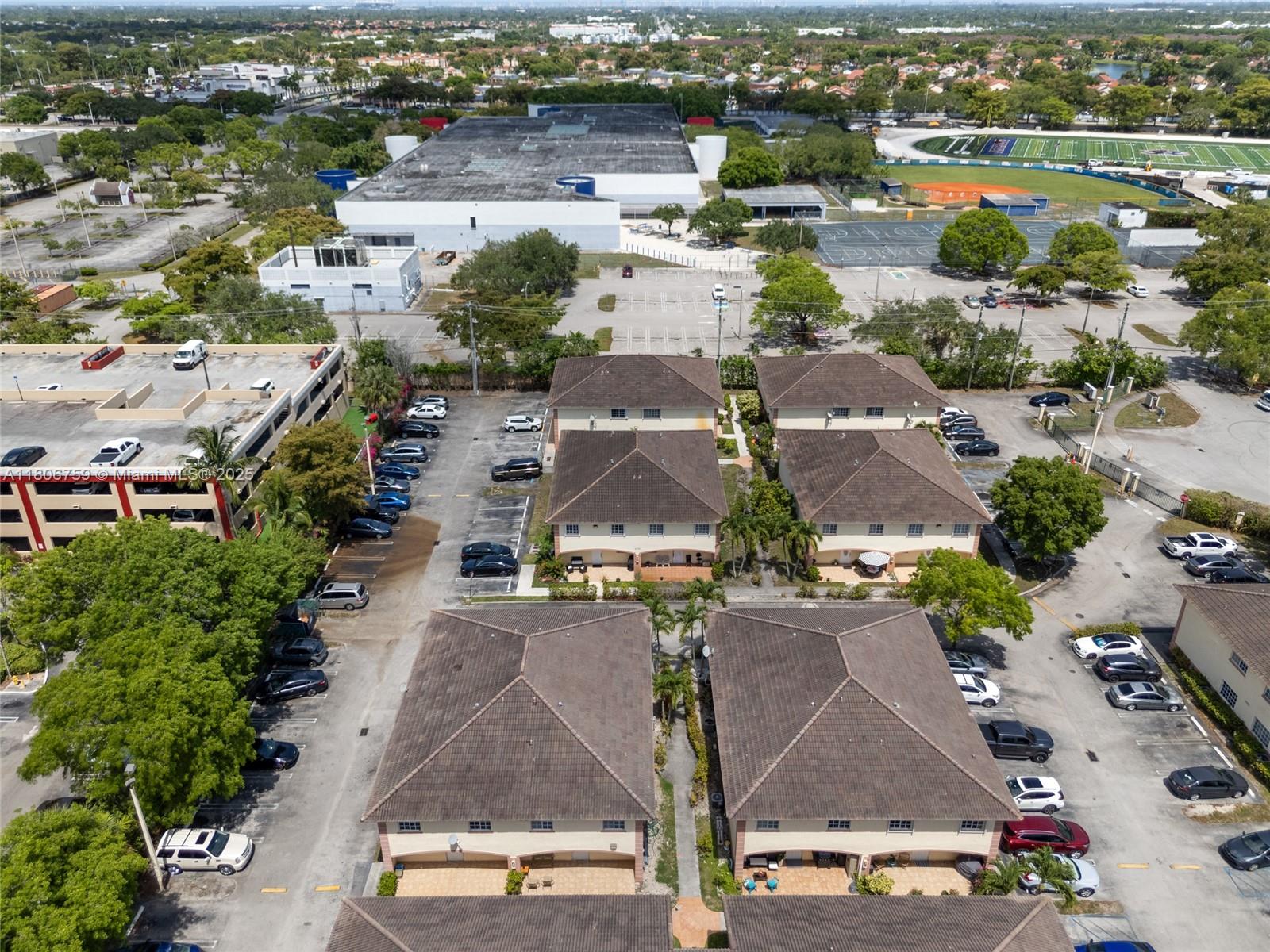 6755 Northwest 182nd Street, Unit 104 Hialeah, FL 33015 - Photo 30 of 33 an aerial view of residential houses with outdoor space